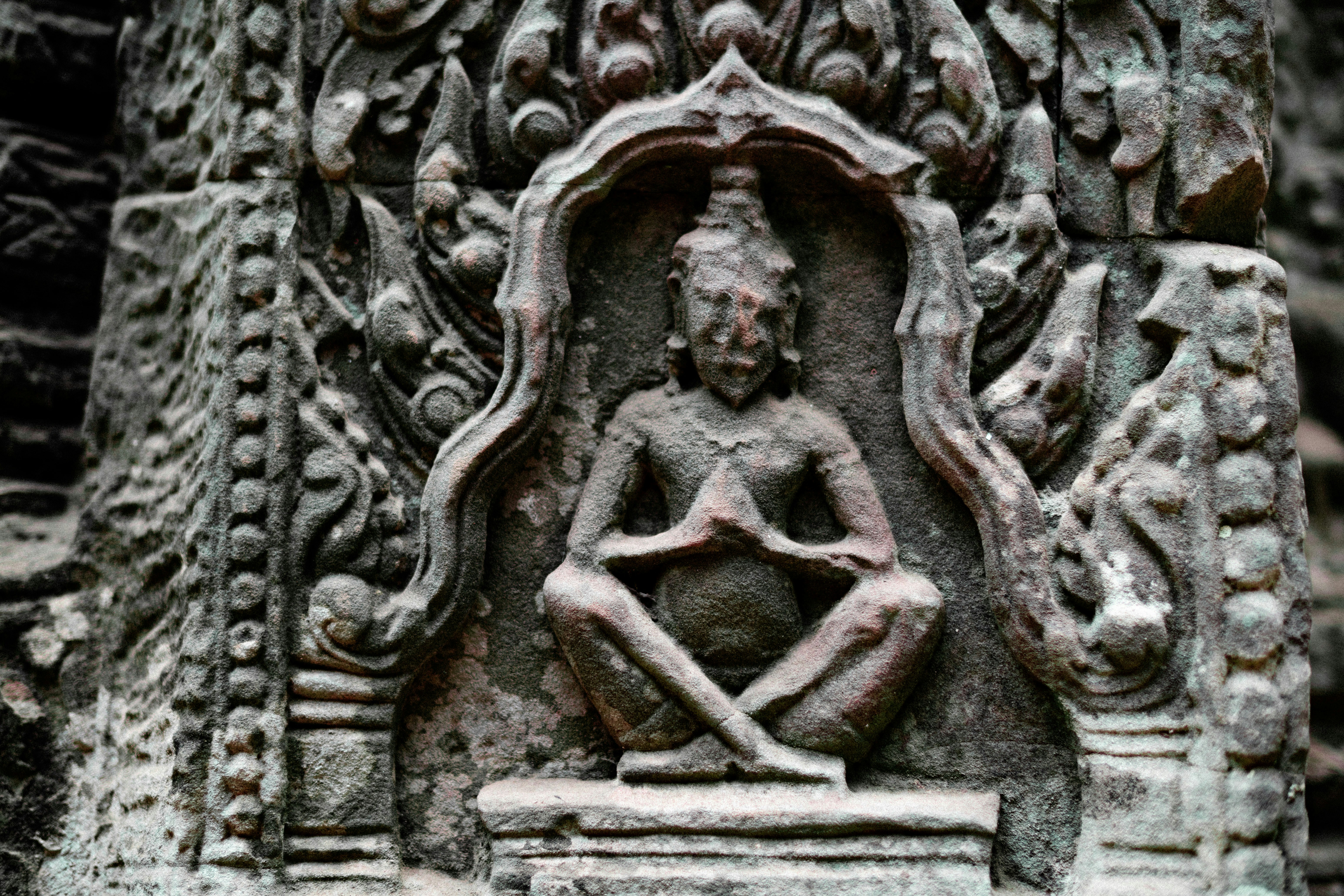 A statue of a person sitting in a chair