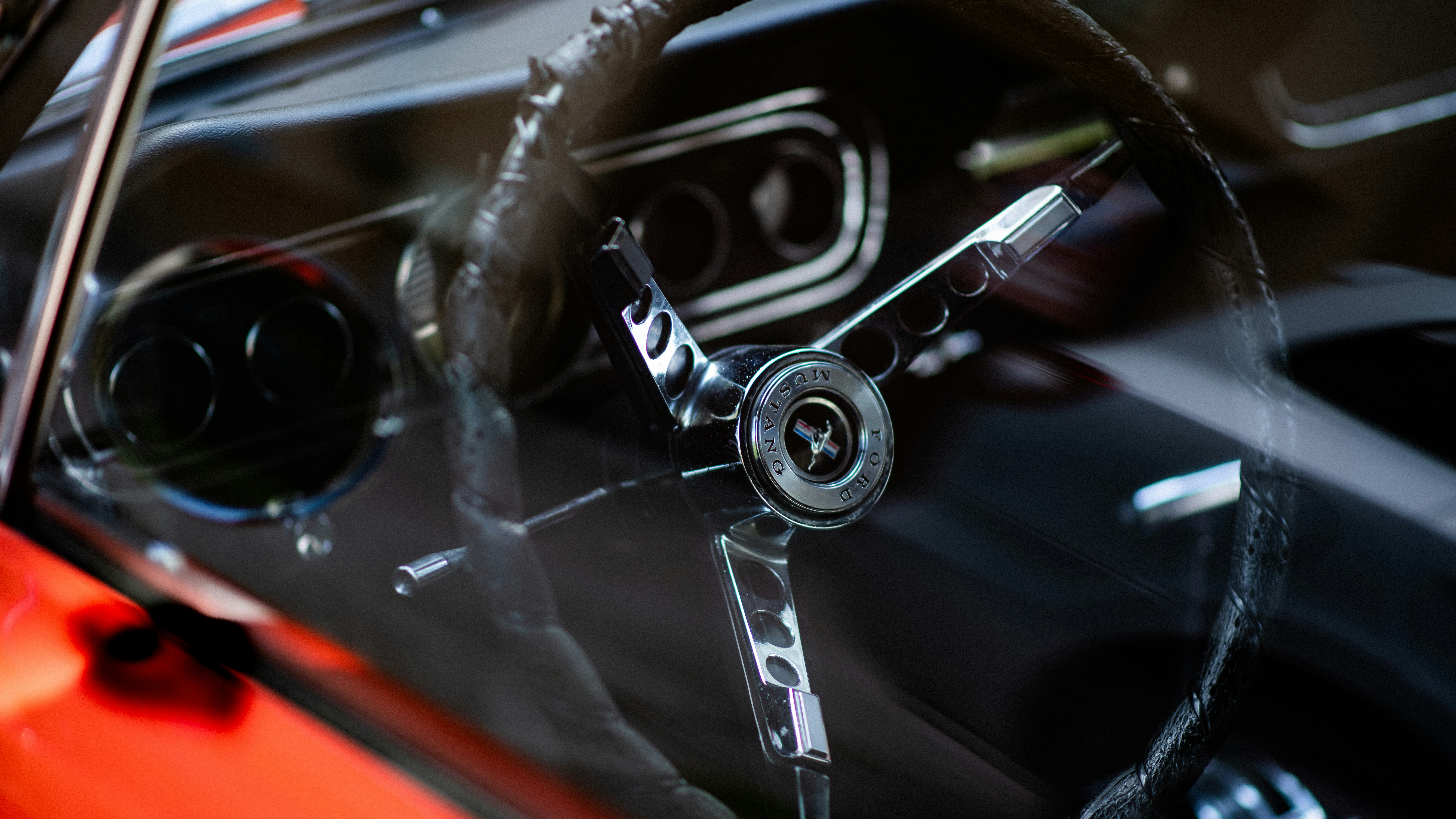 A close up of a steering wheel on a car