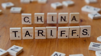 A close up of scrabble tiles spelling the word china tarifs