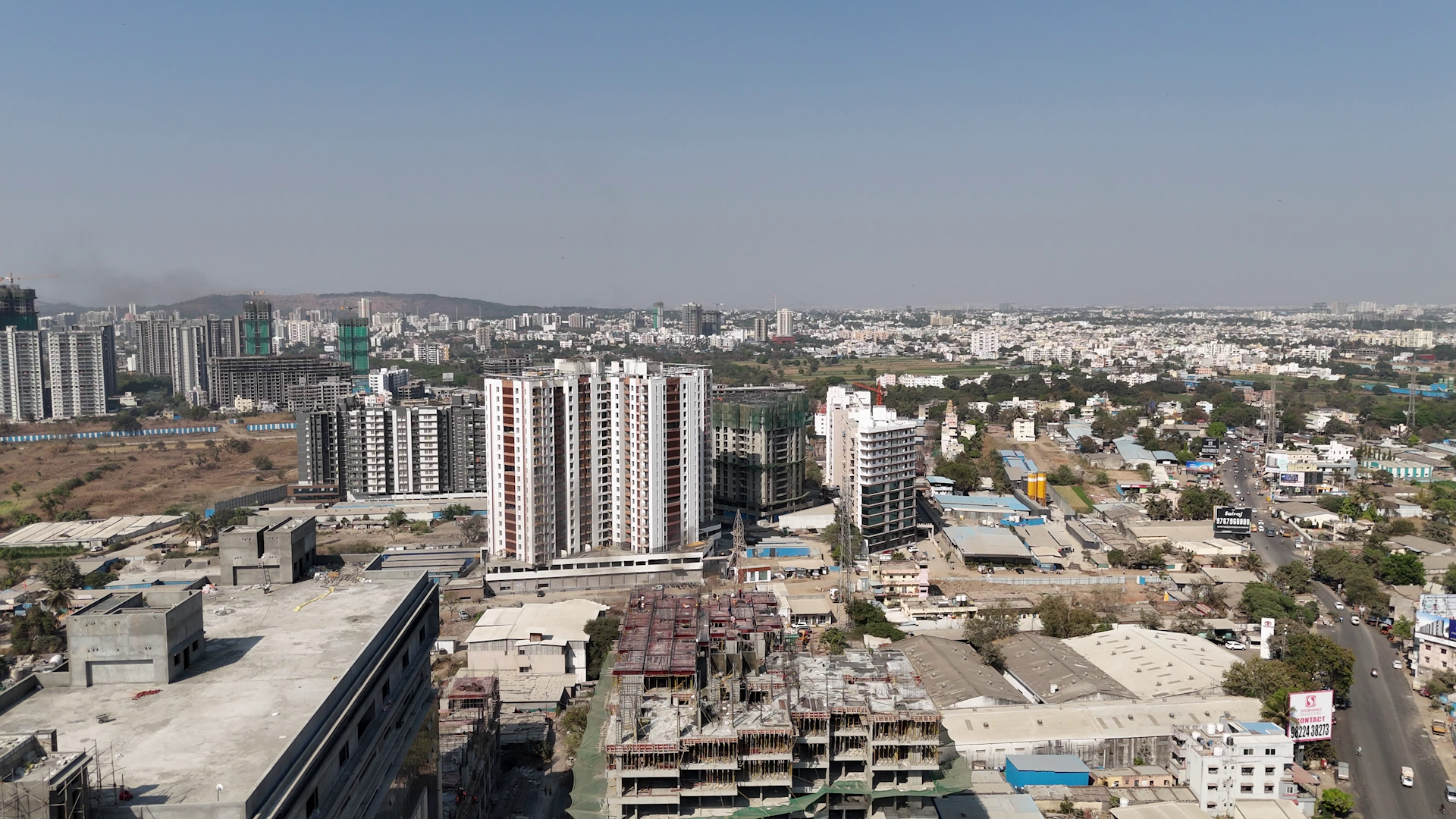 An aerial view of a city with tall buildings