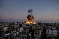 A large fire is burning in a city