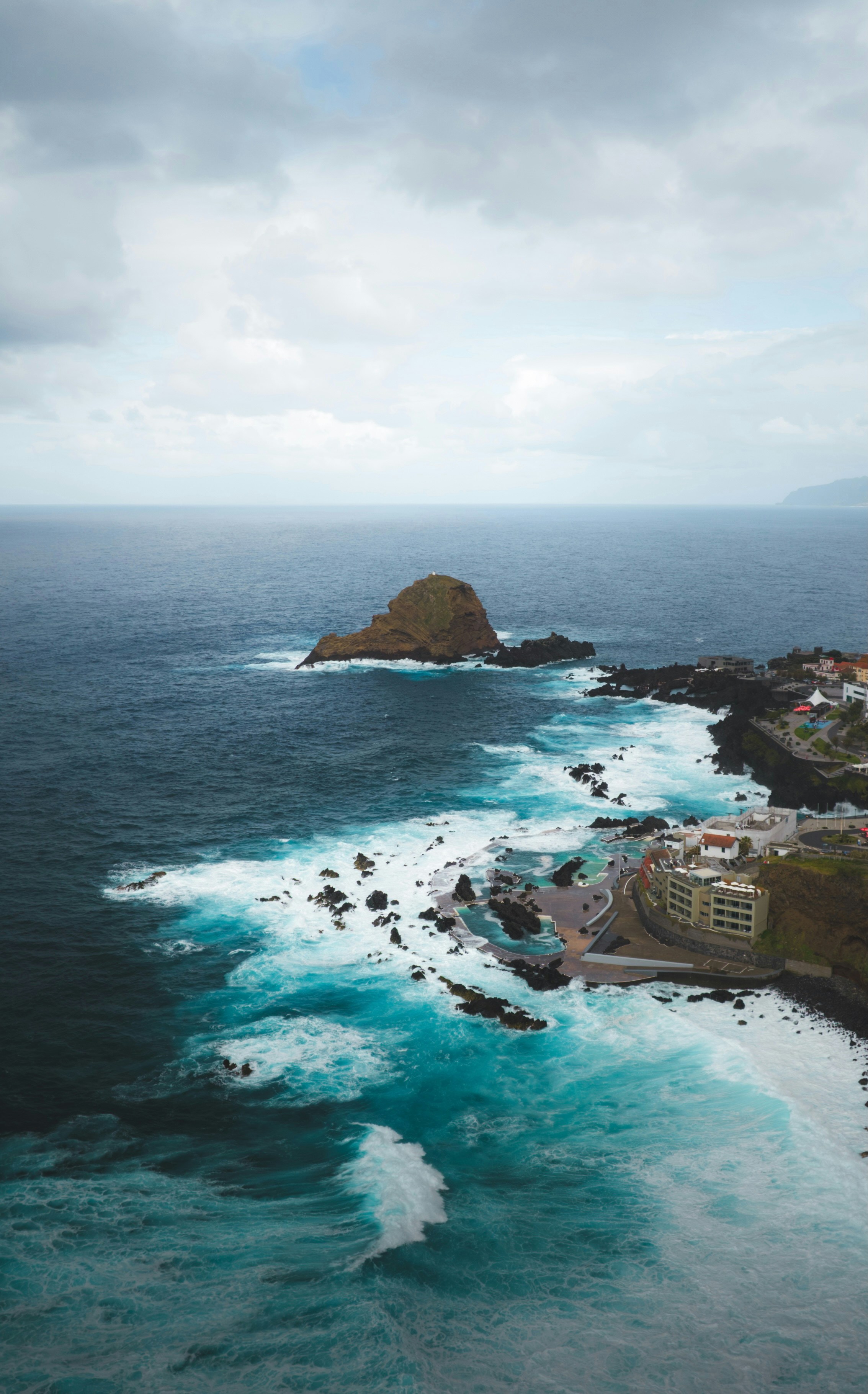 An aerial view of the ocean and coastline
