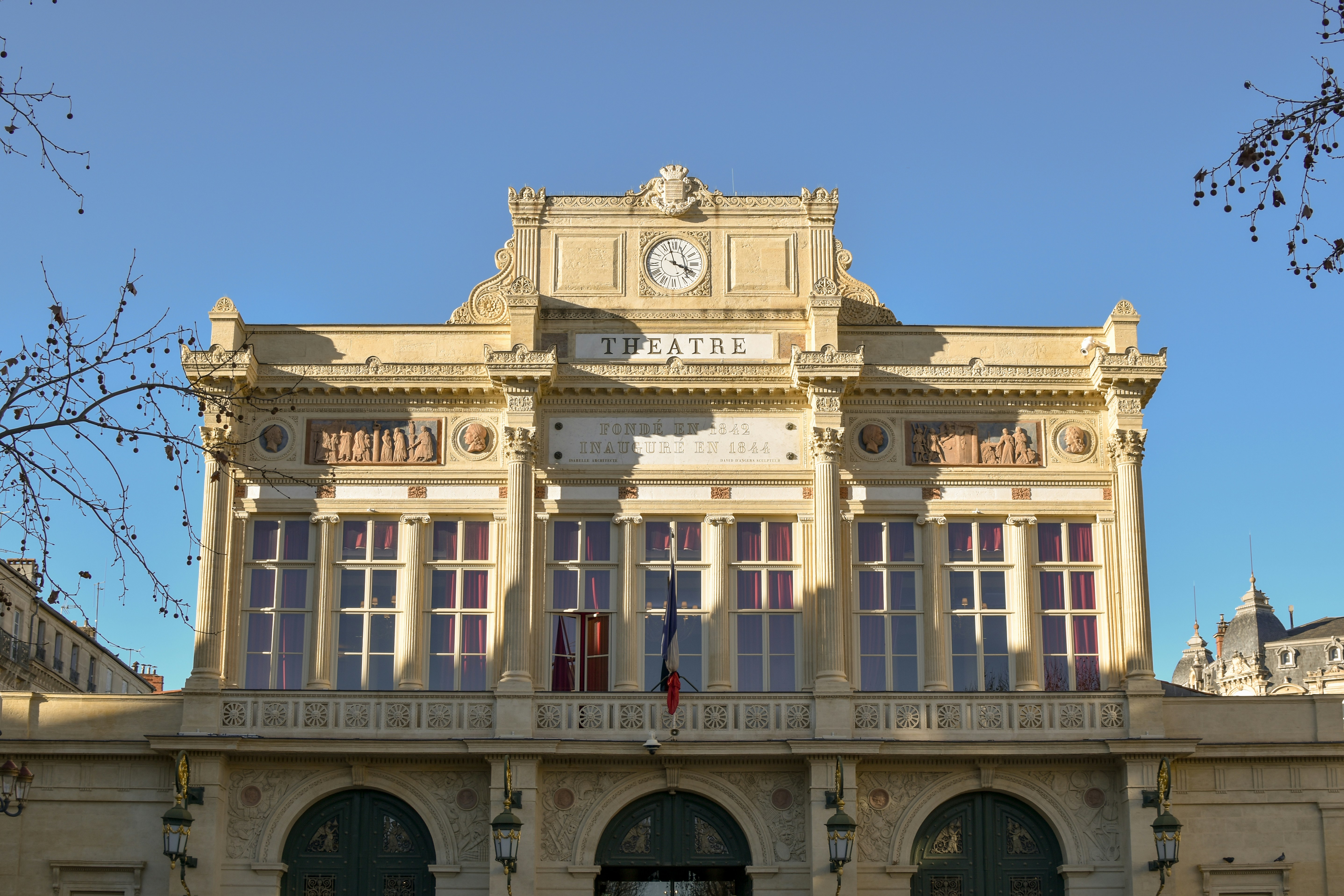 A large building with a clock on the top of it