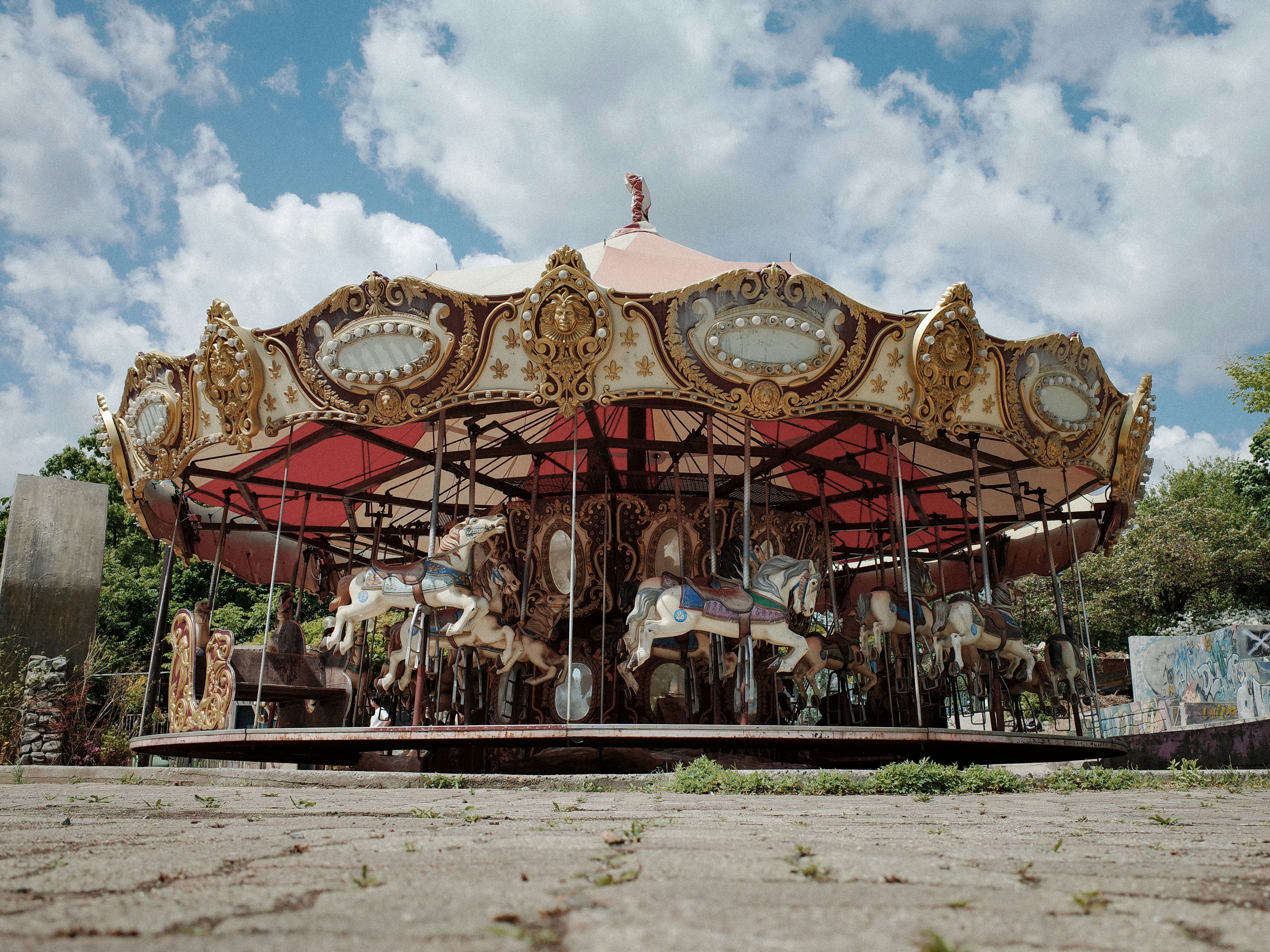 An old fashioned merry go round in the middle of a field