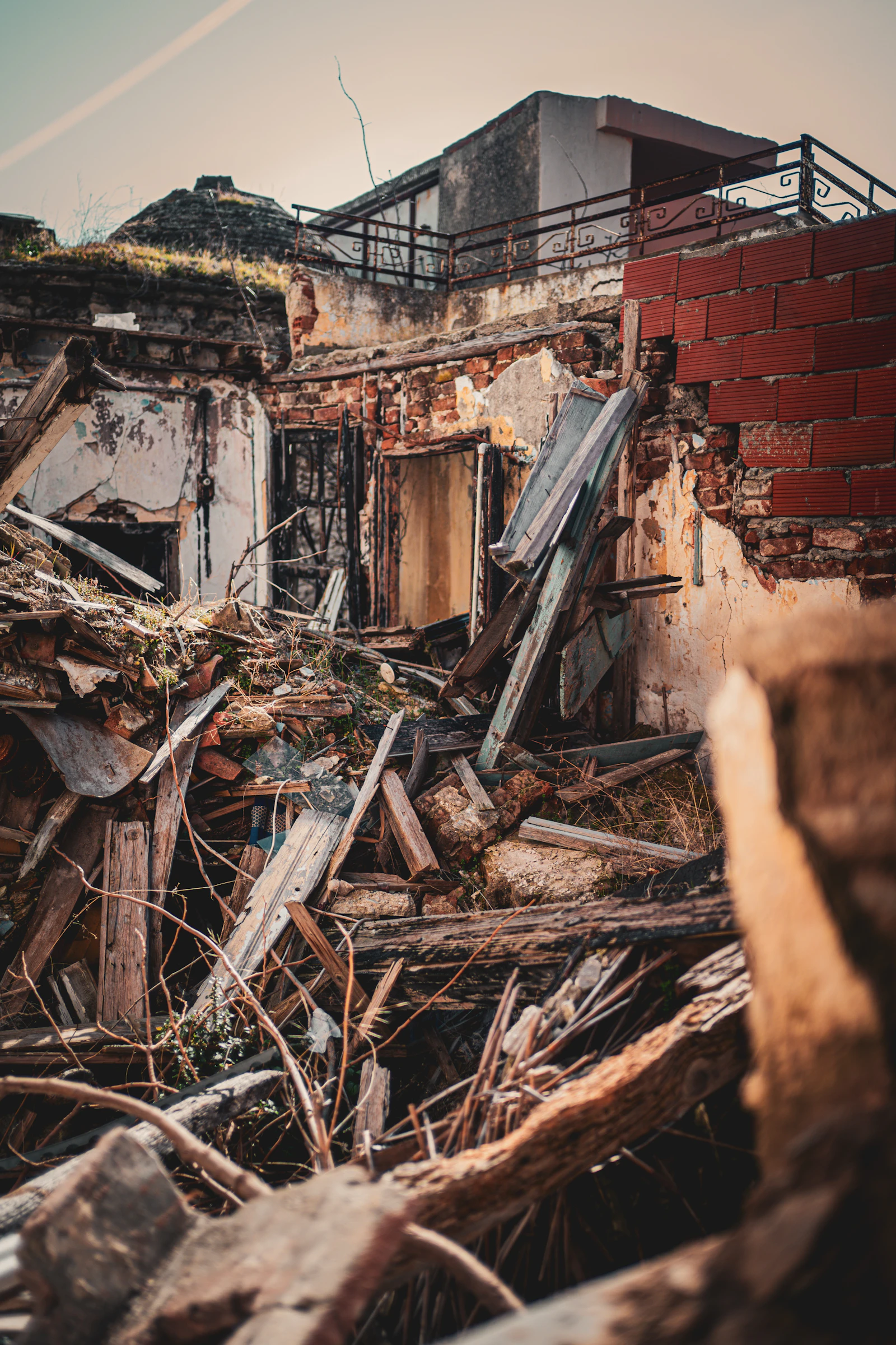 Demolition site with debris pile representing warning signs of poor planning
