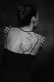 A woman with a tattoo on her back