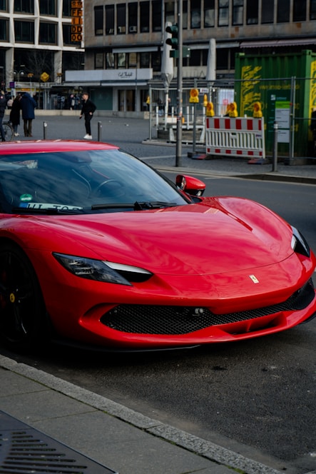 A red sports car parked on the side of the road
