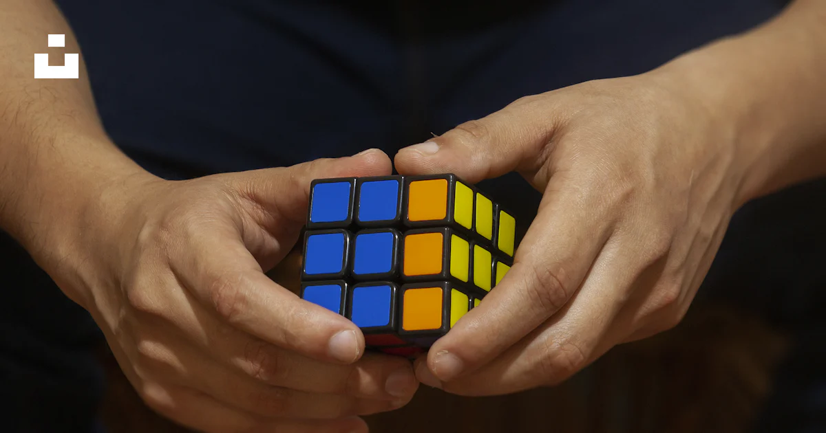 Child holding a colorful puzzle toy