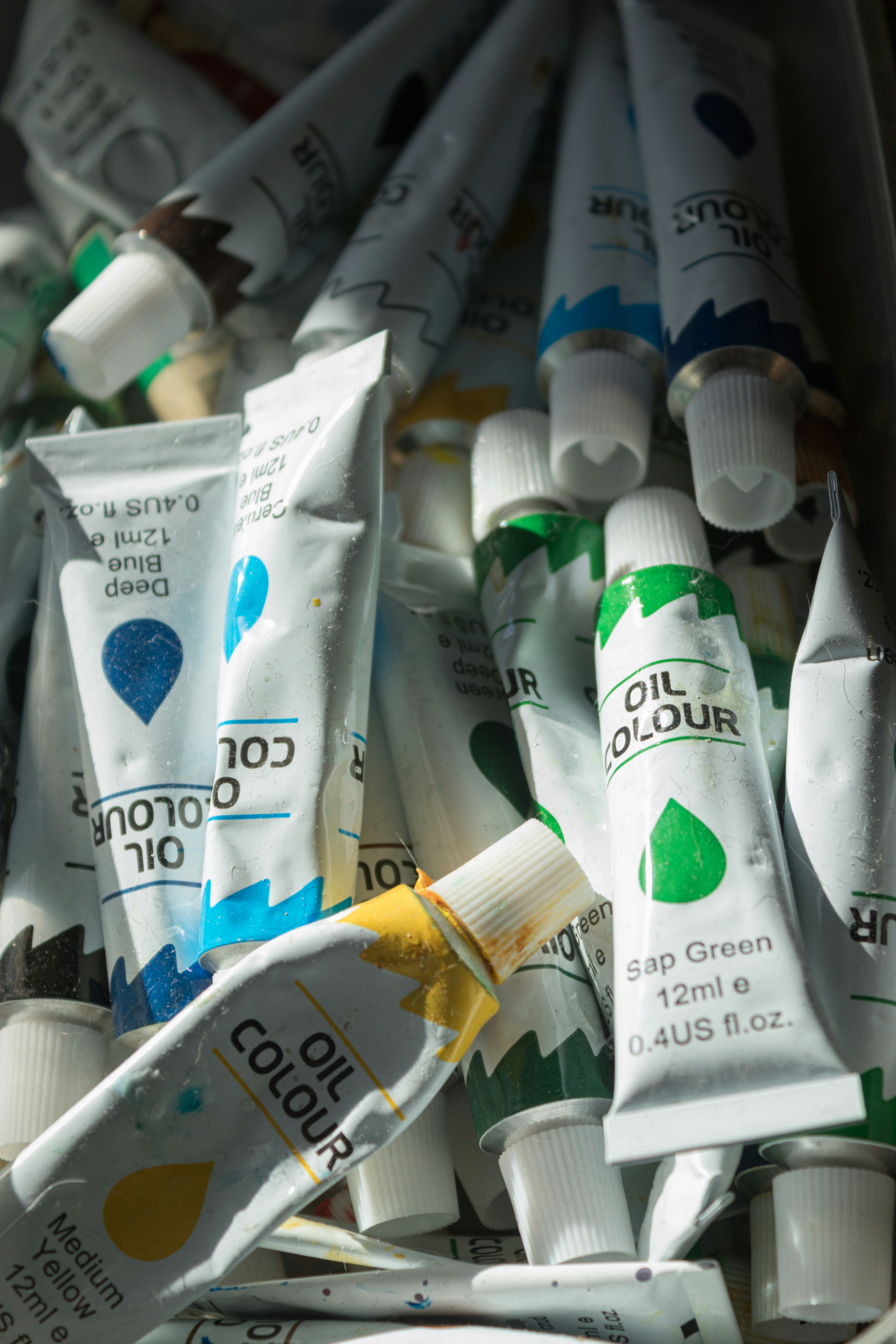 A bunch of tubes of toothpaste sitting next to each other