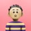 A small toy is standing in front of a pink background