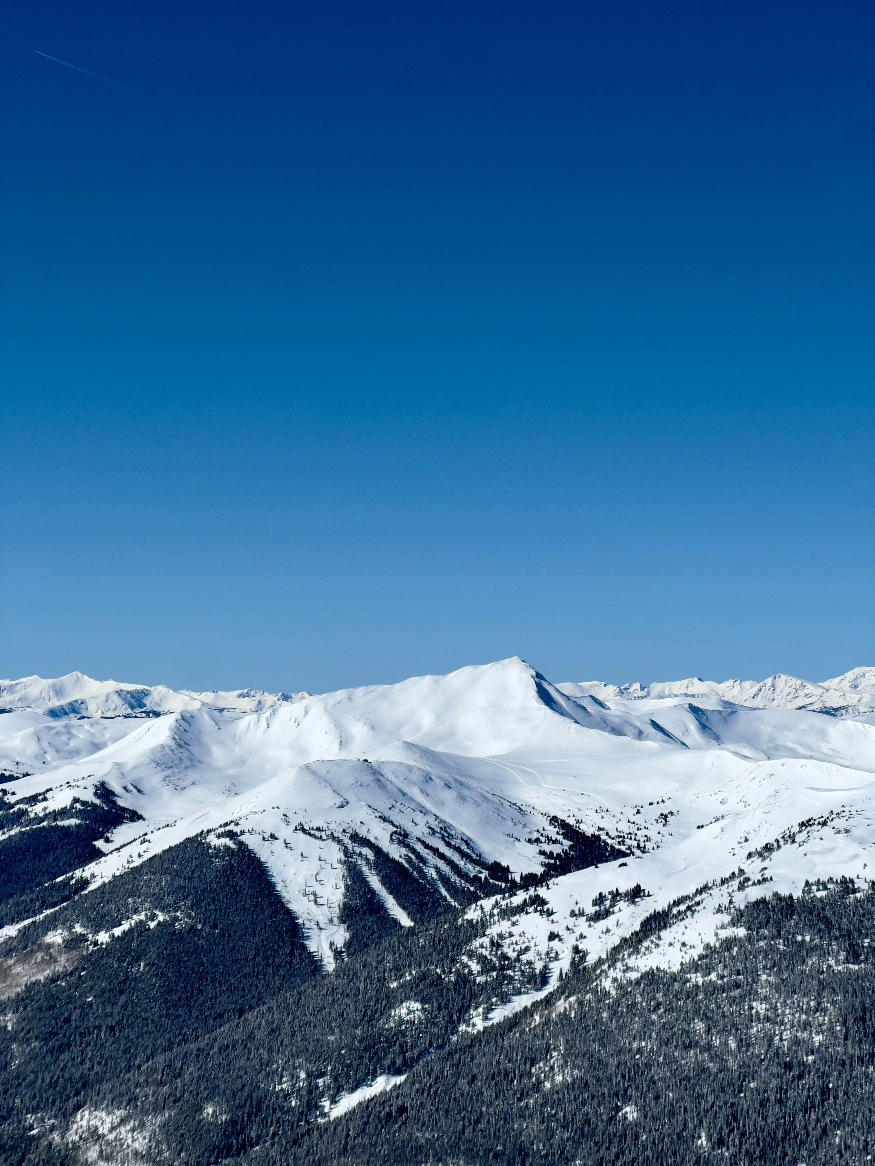 A snowboarder is doing a trick in the air