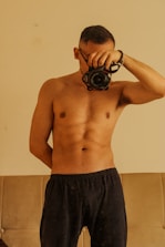 A man holding a camera up to his face