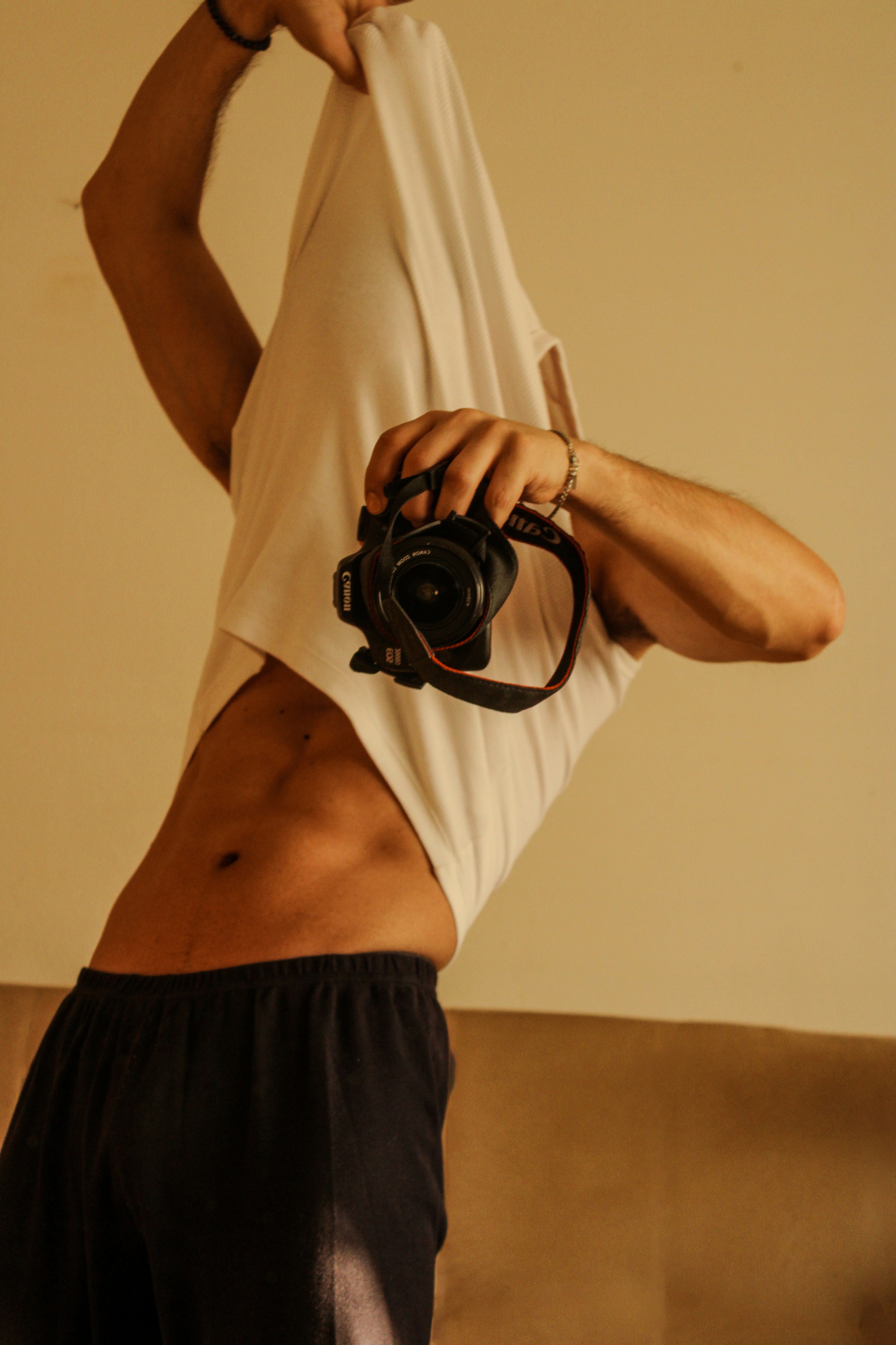 A man holding a camera up to his face