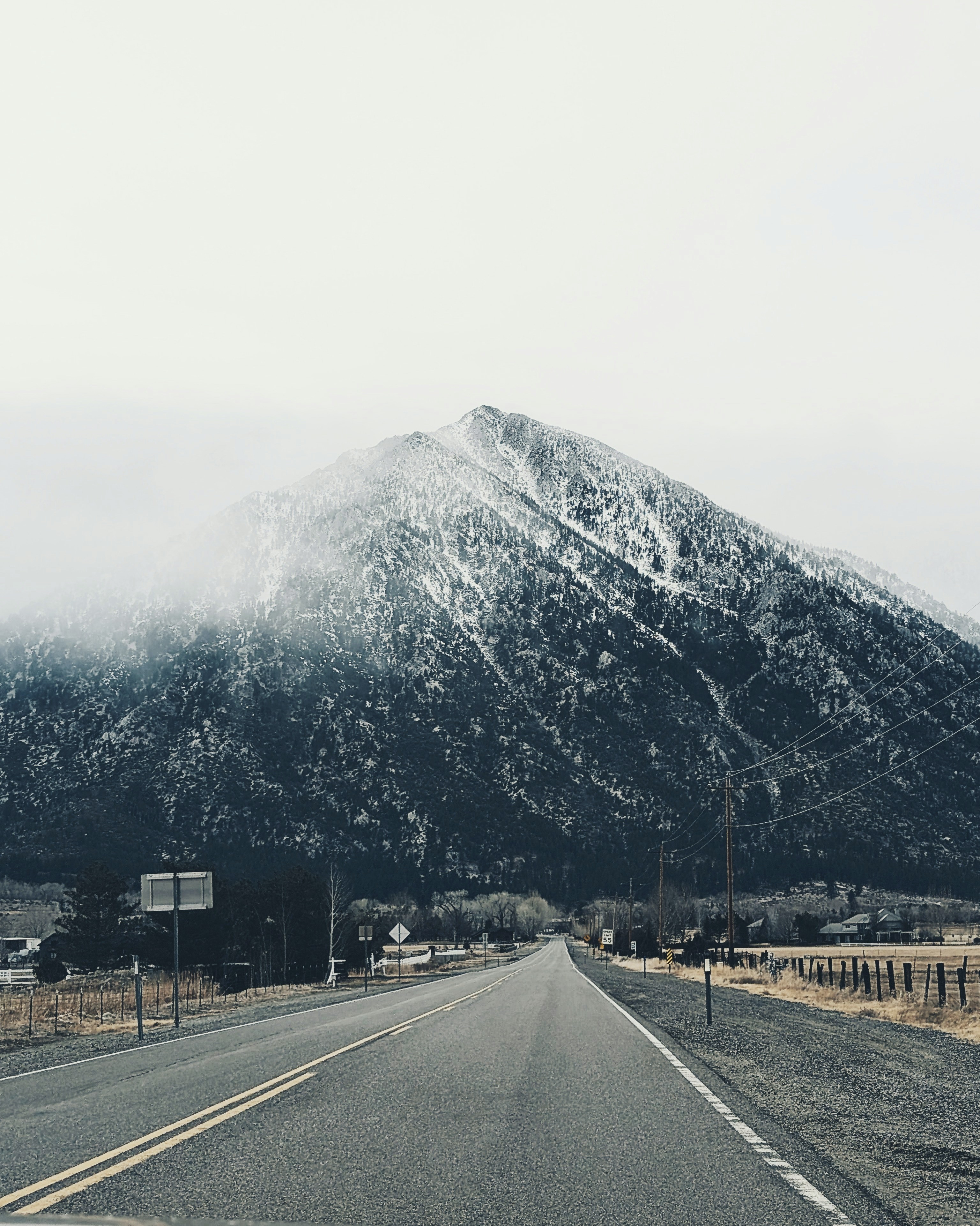 A road with a mountain in the background