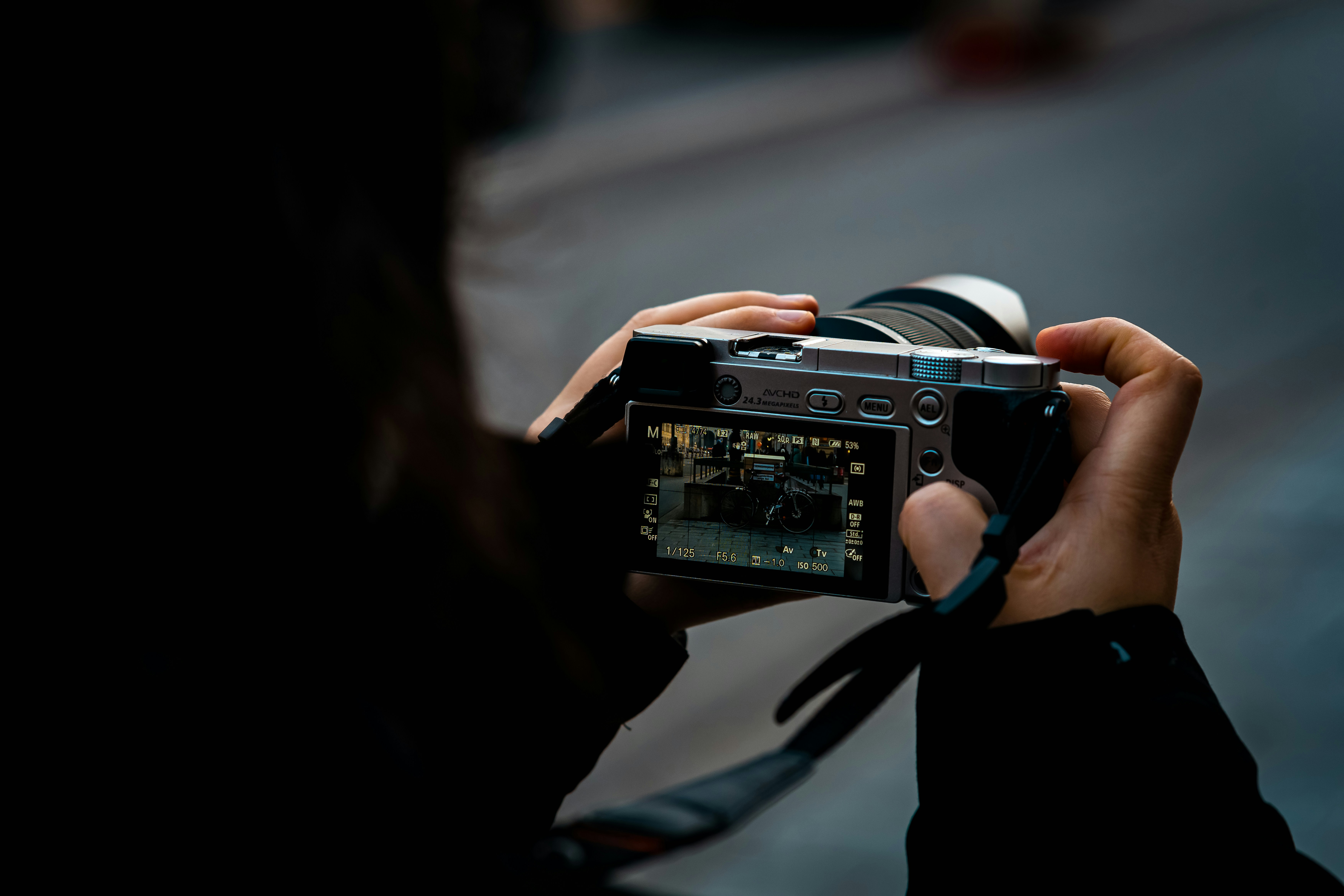 A person holding a camera up to take a picture