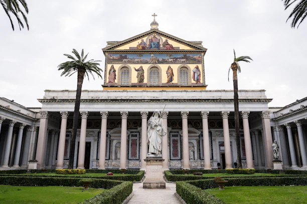 A large building with a statue in front of it