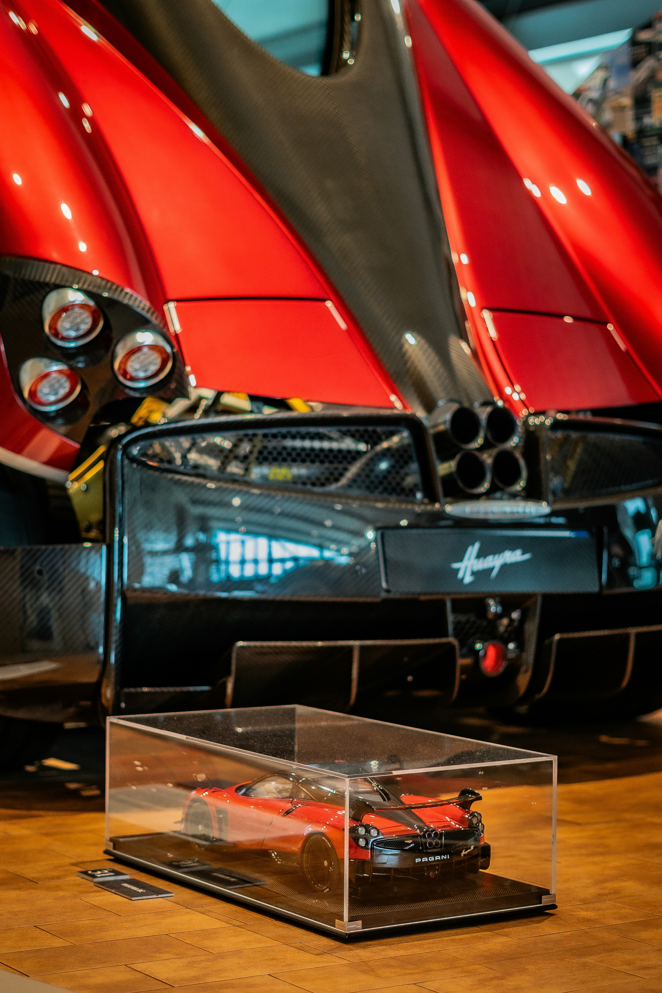 A red car is on display in a museum photo – Free Car Image on Unsplash