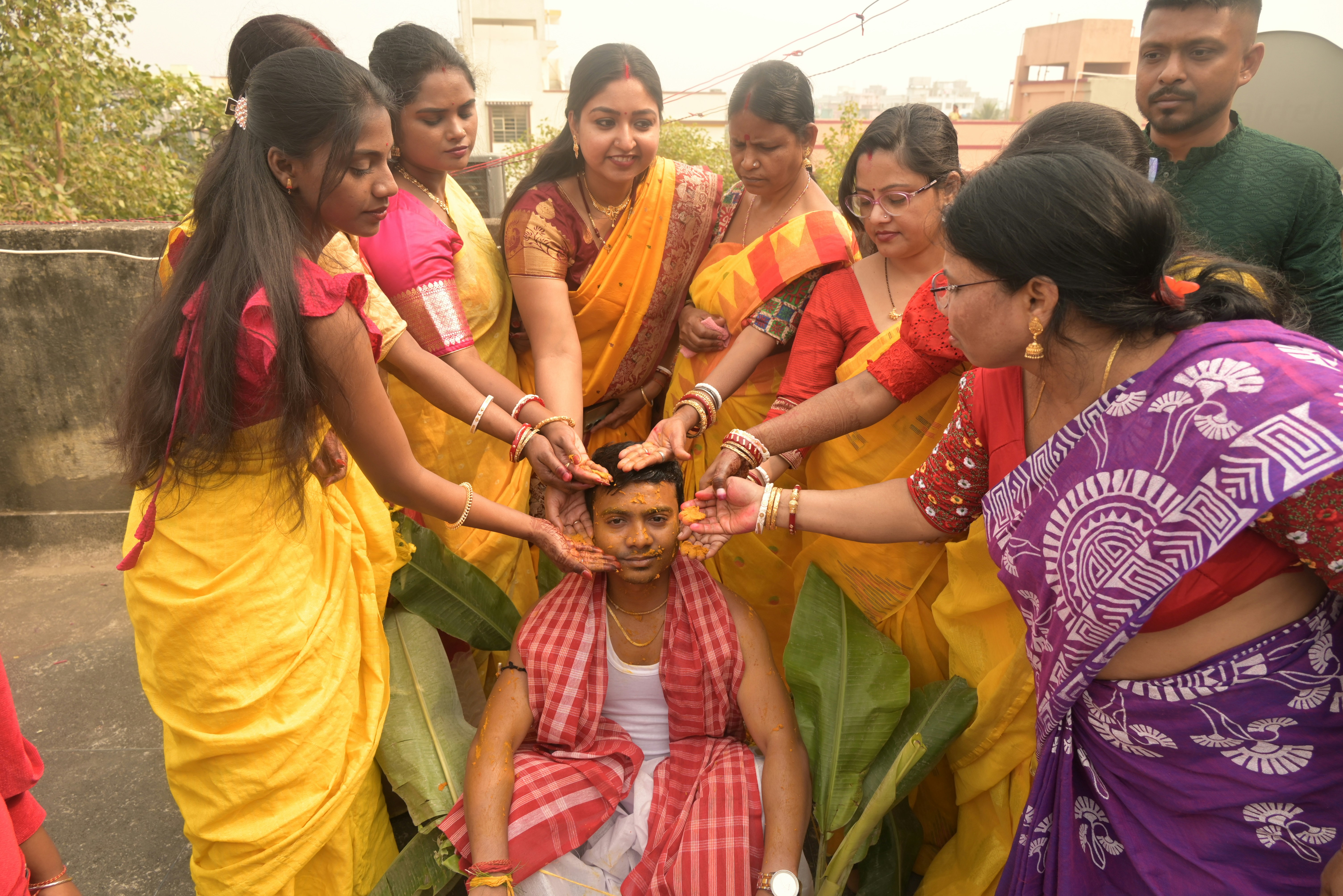 A group of people standing around each other