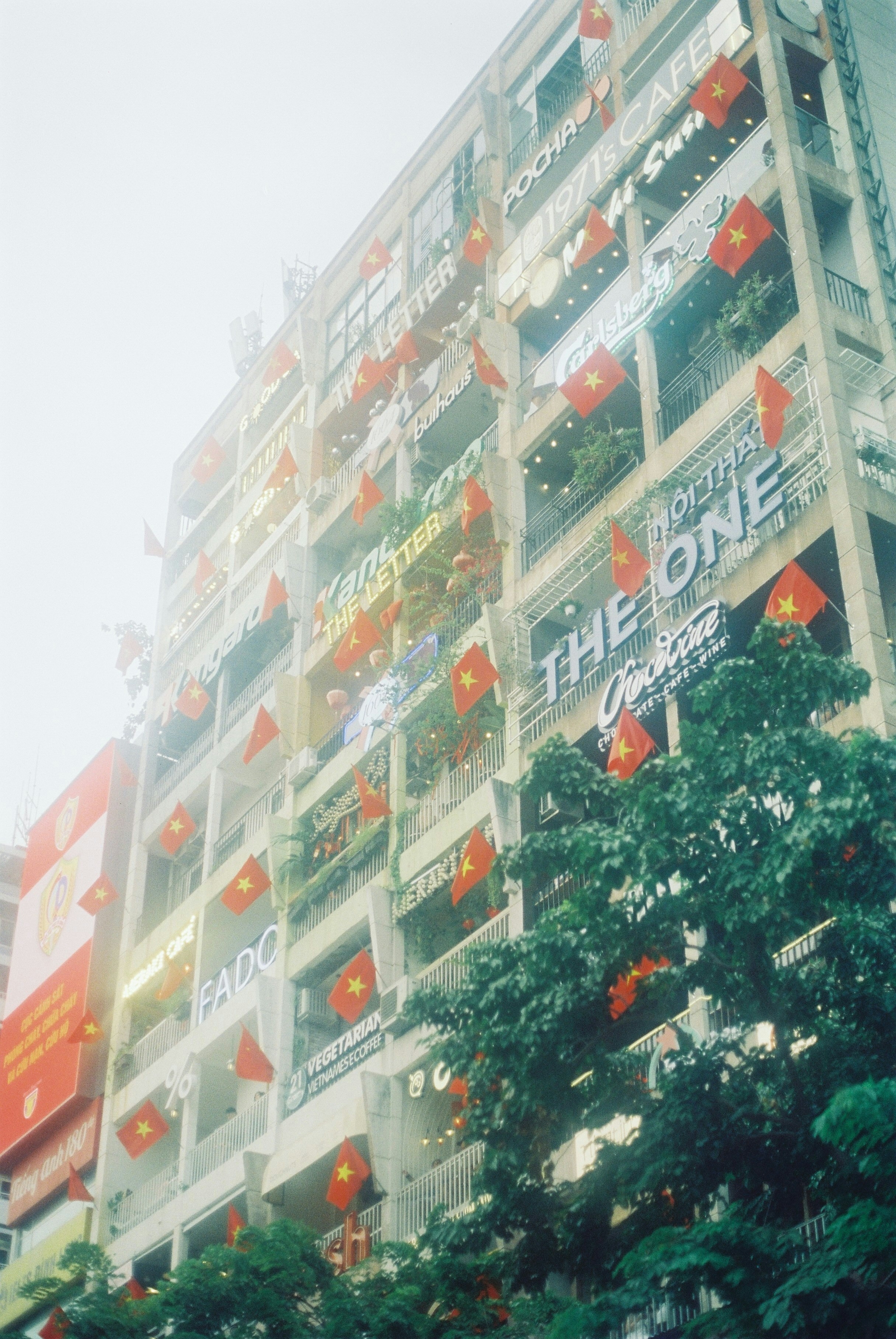 A tall building with lots of balconies on it