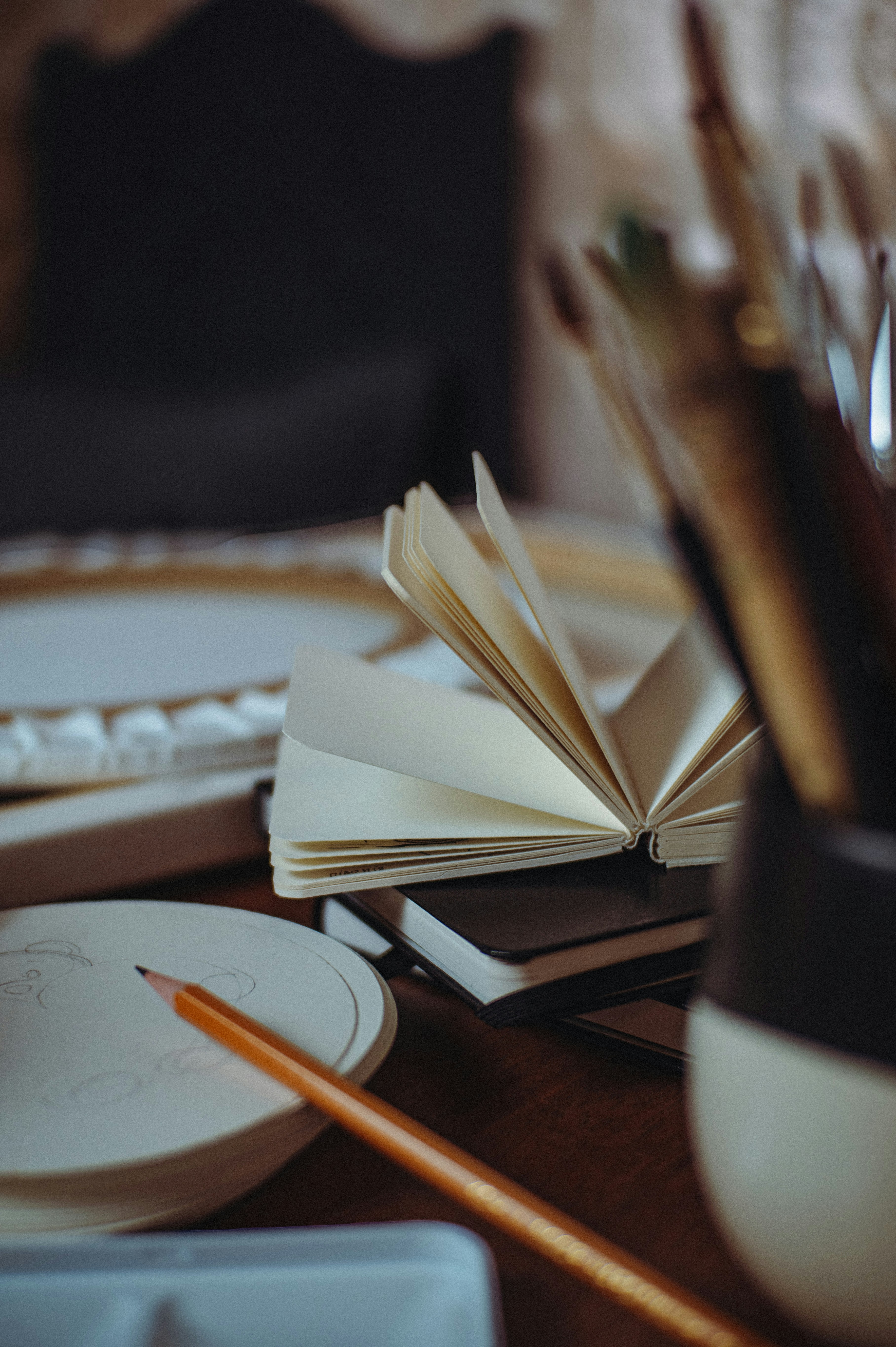 An open book sitting on top of a wooden table