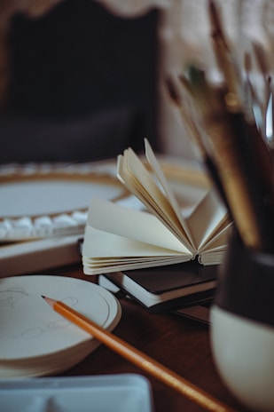 An open book sitting on top of a wooden table
