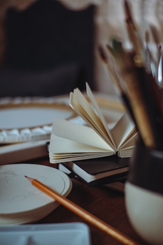 An open book sitting on top of a wooden table