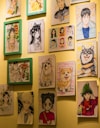 A wall with a bunch of pictures on it
