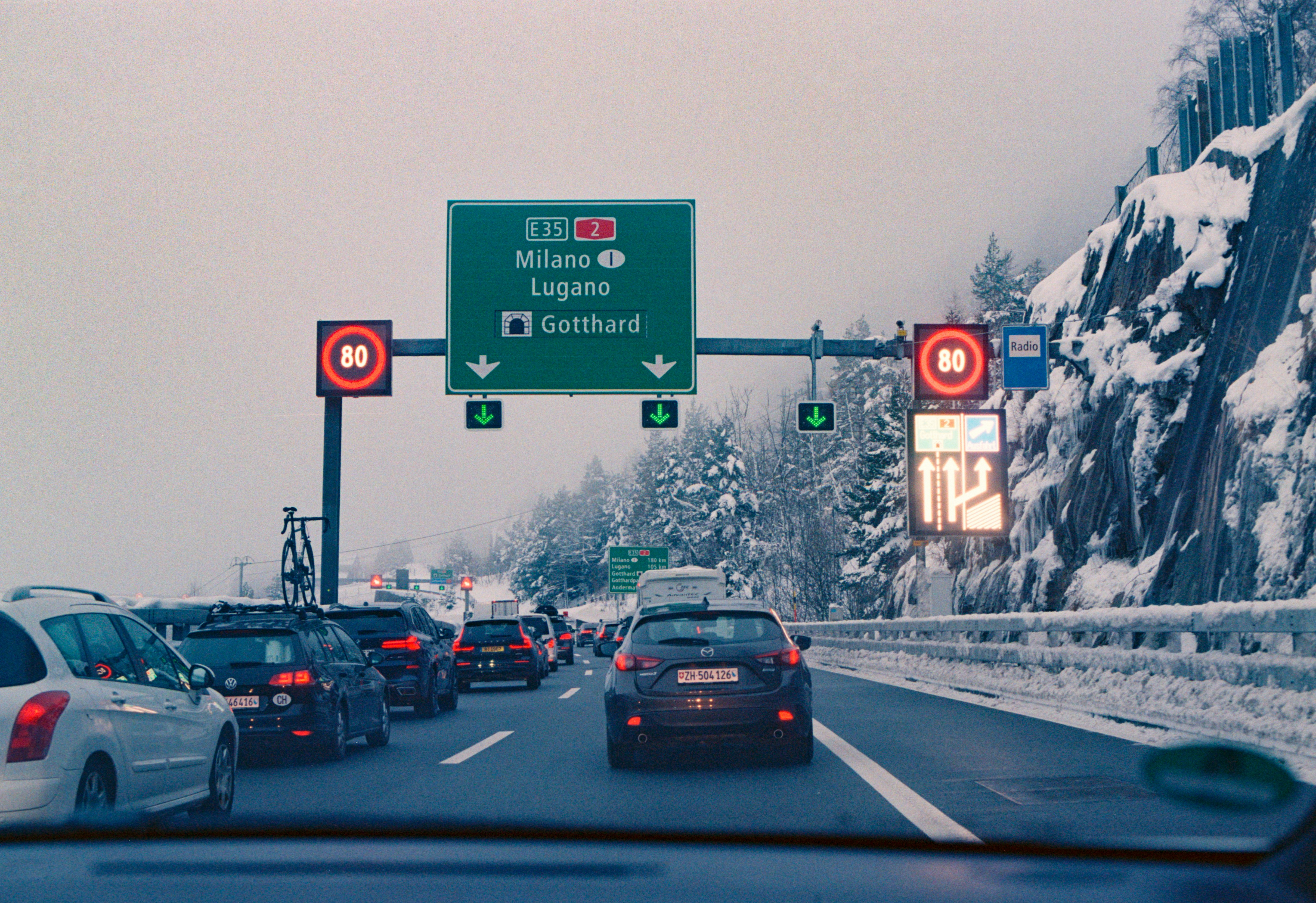 A bunch of cars that are sitting in the street
