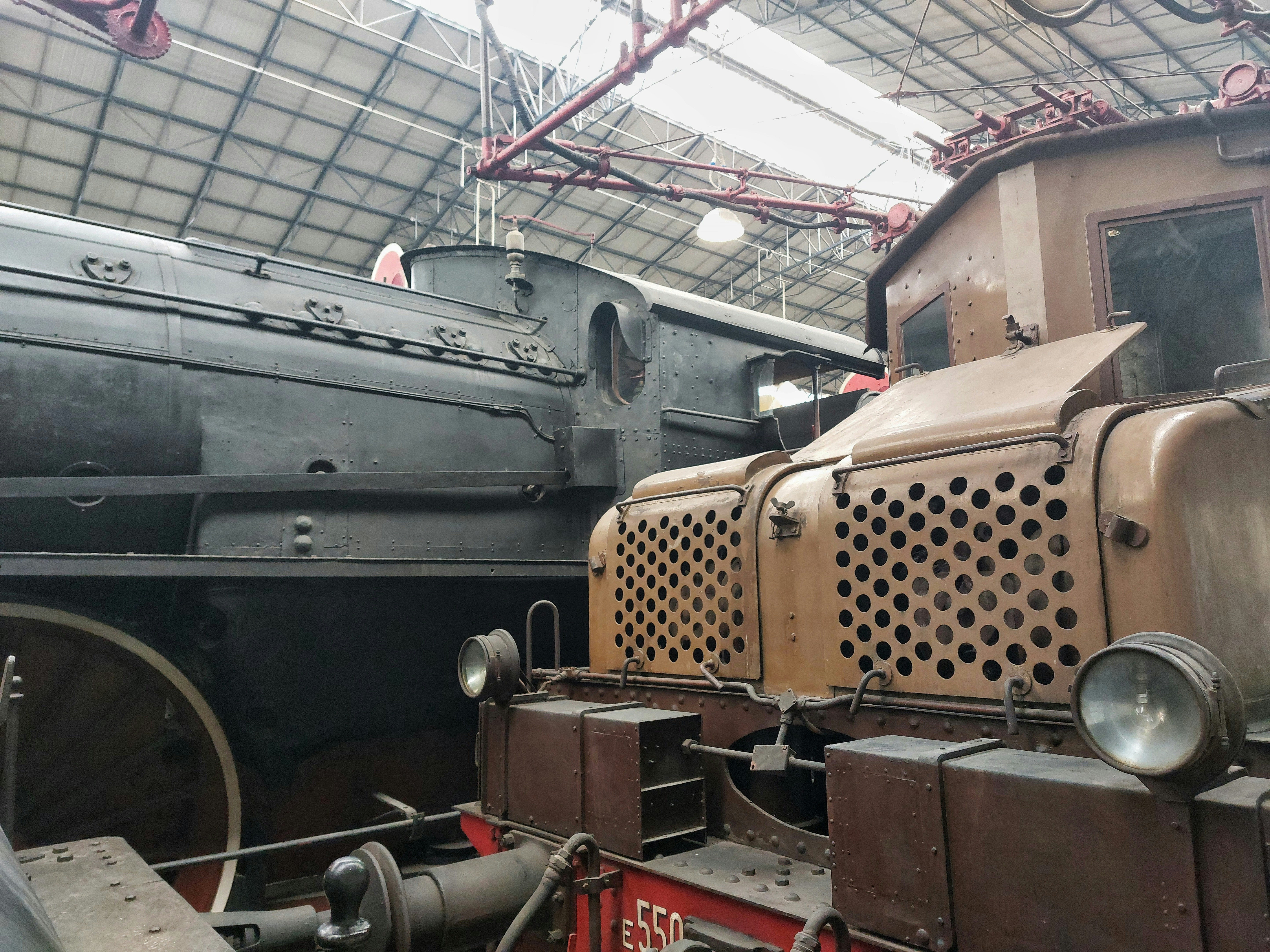 A train is parked inside of a train station