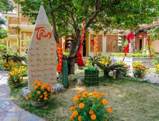 A small garden with flowers and a coca cola sign