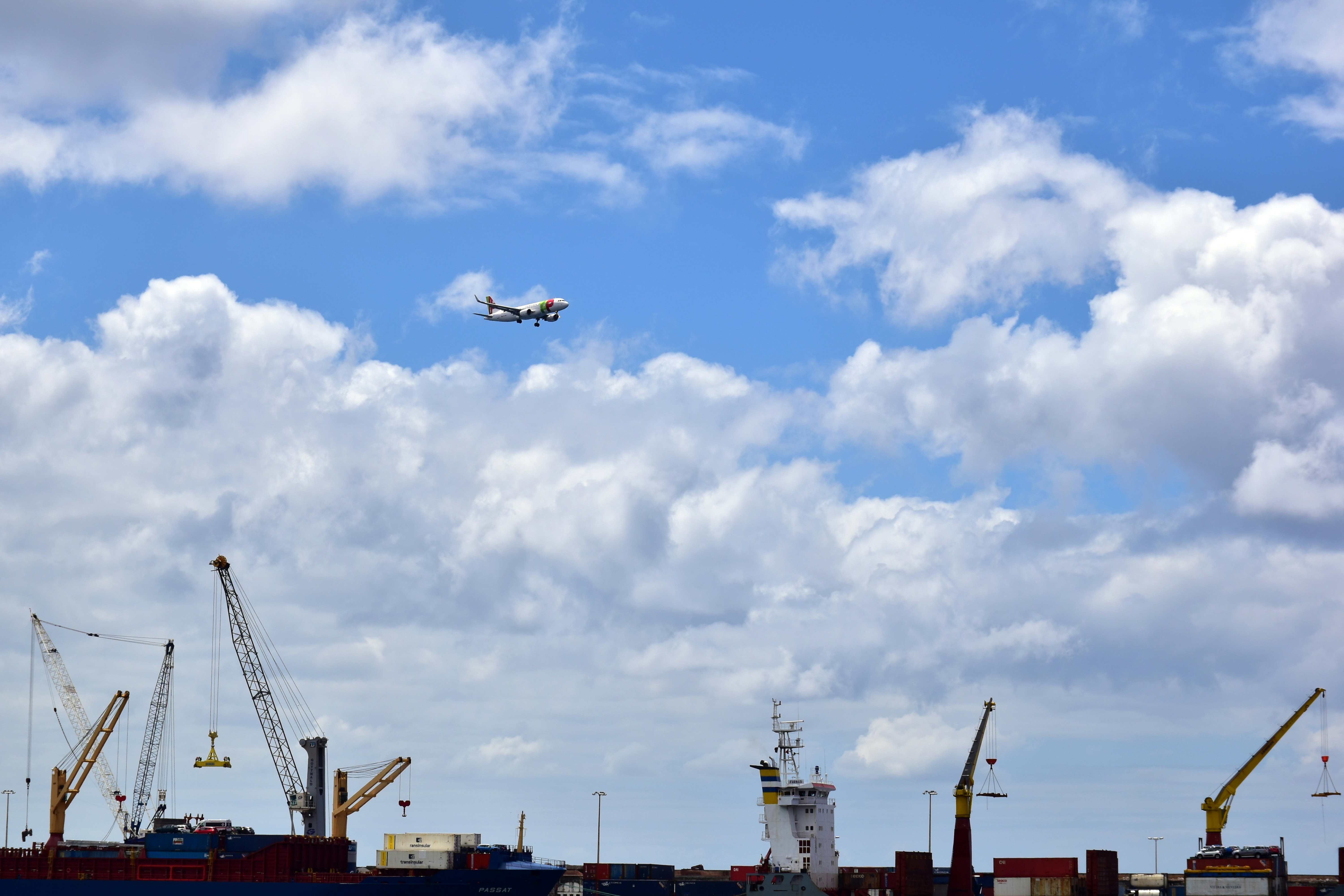 A plane is flying over a large body of water