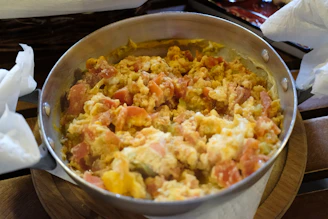 A pot of food sitting on top of a wooden table