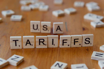 A close up of scrabble tiles spelling the word usa, tarifs