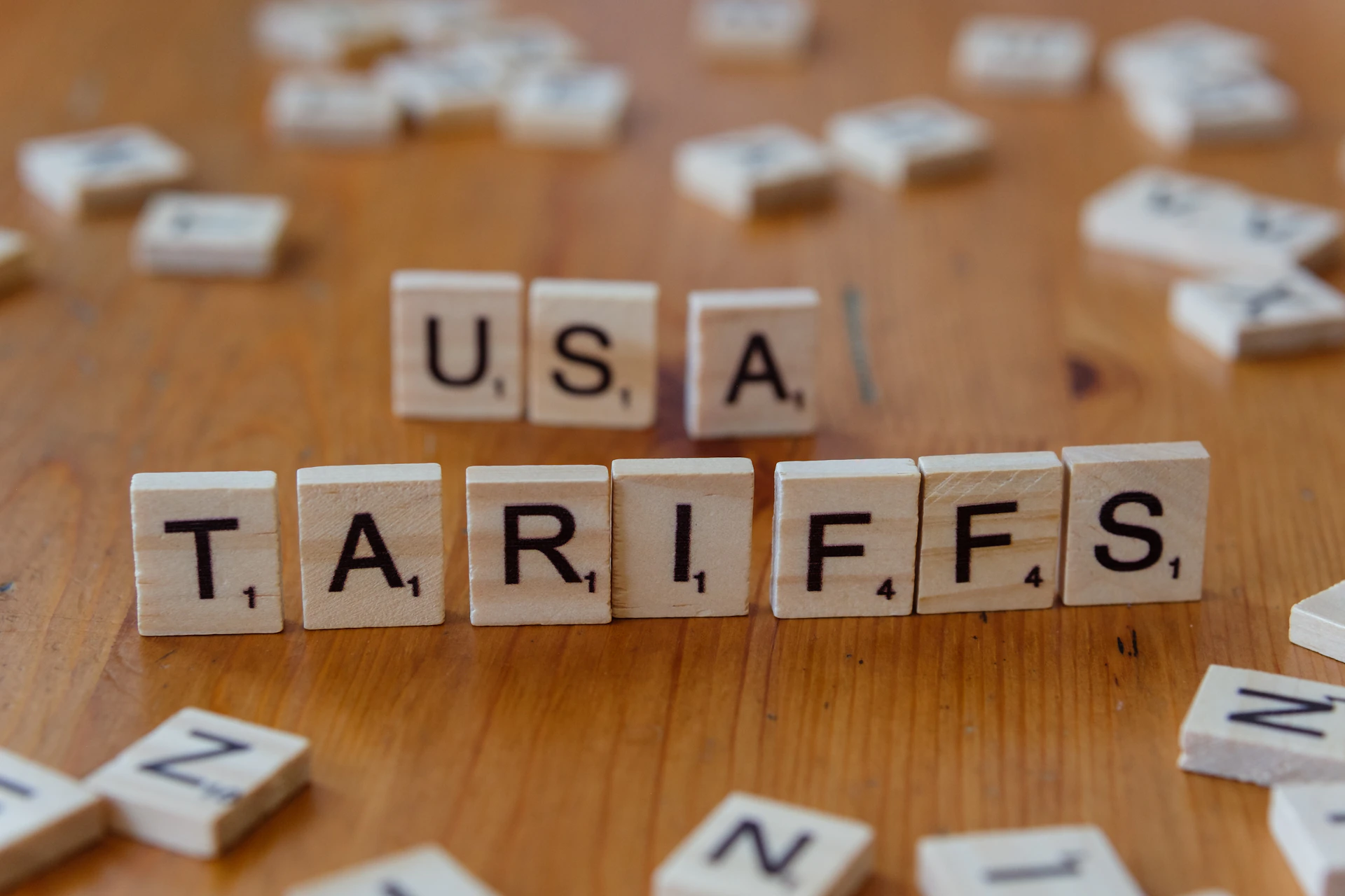 A close up of scrabble tiles spelling the word usa, tarifs