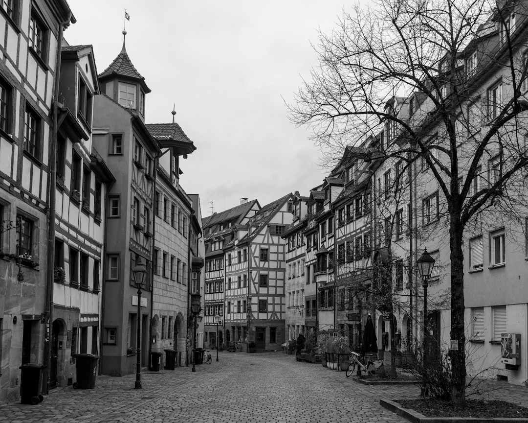 A black and white photo of a cobblestone street, Street in an old town