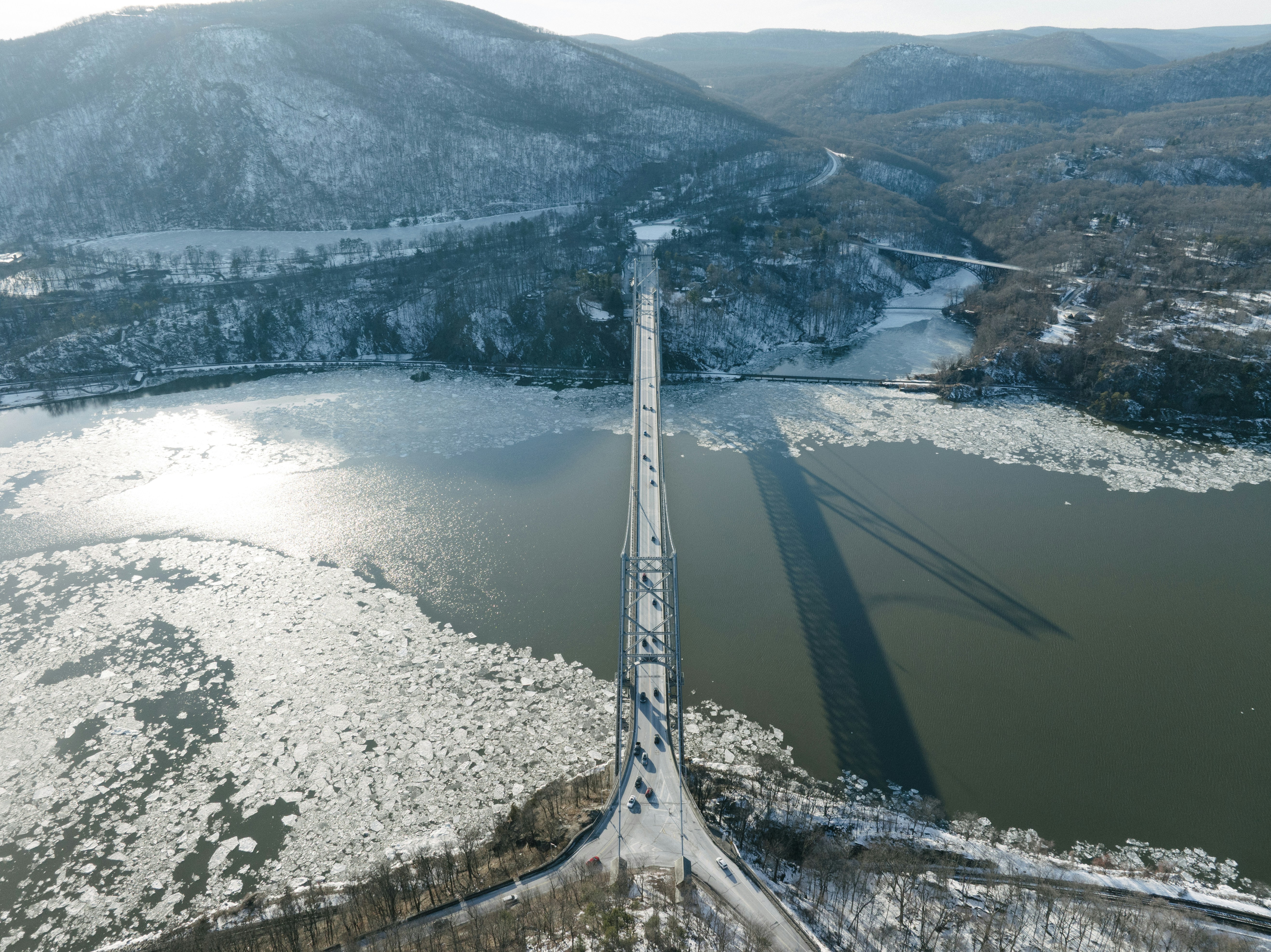 An aerial view of a bridge over a river