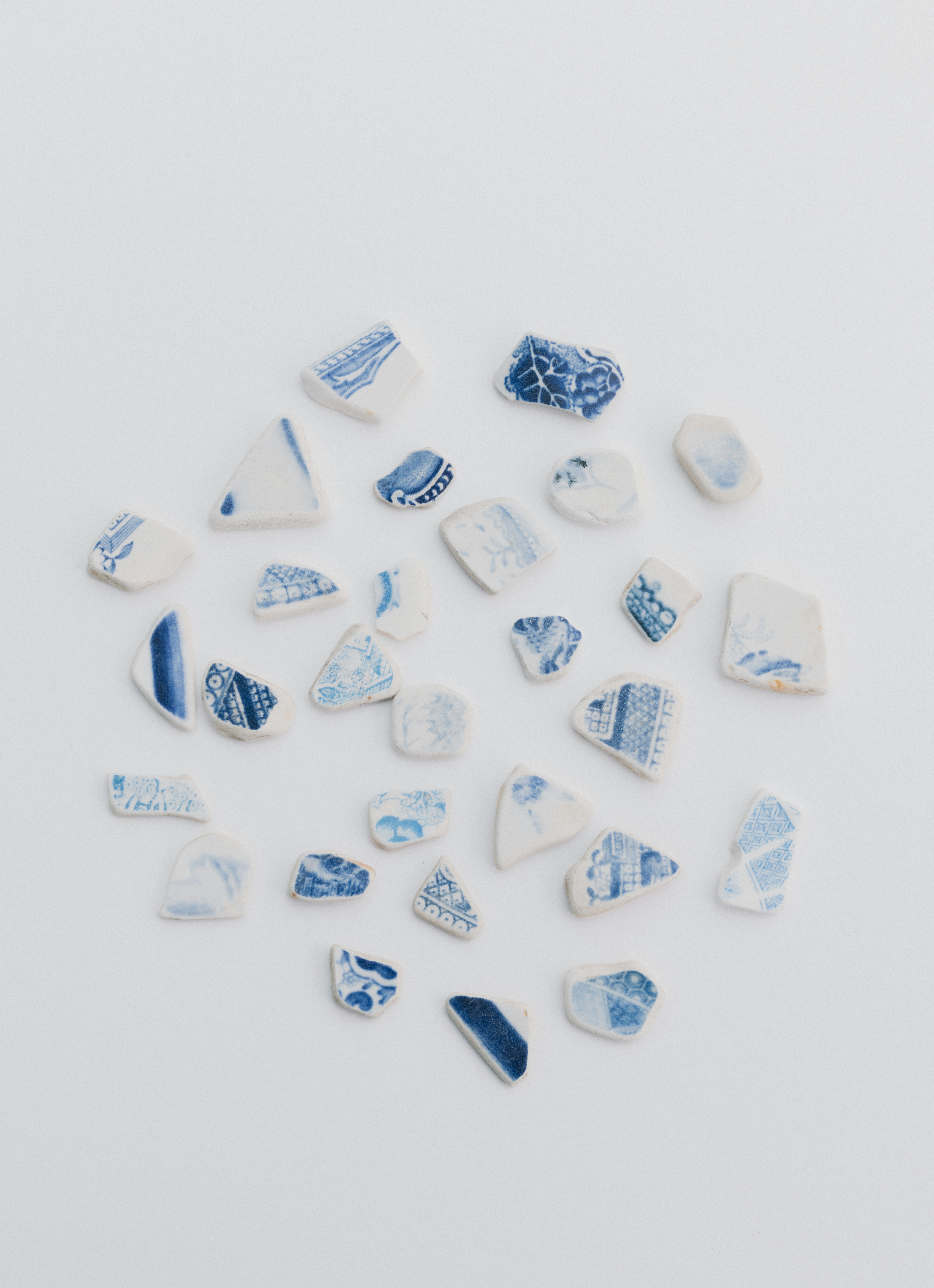 A pile of blue and white glass pieces