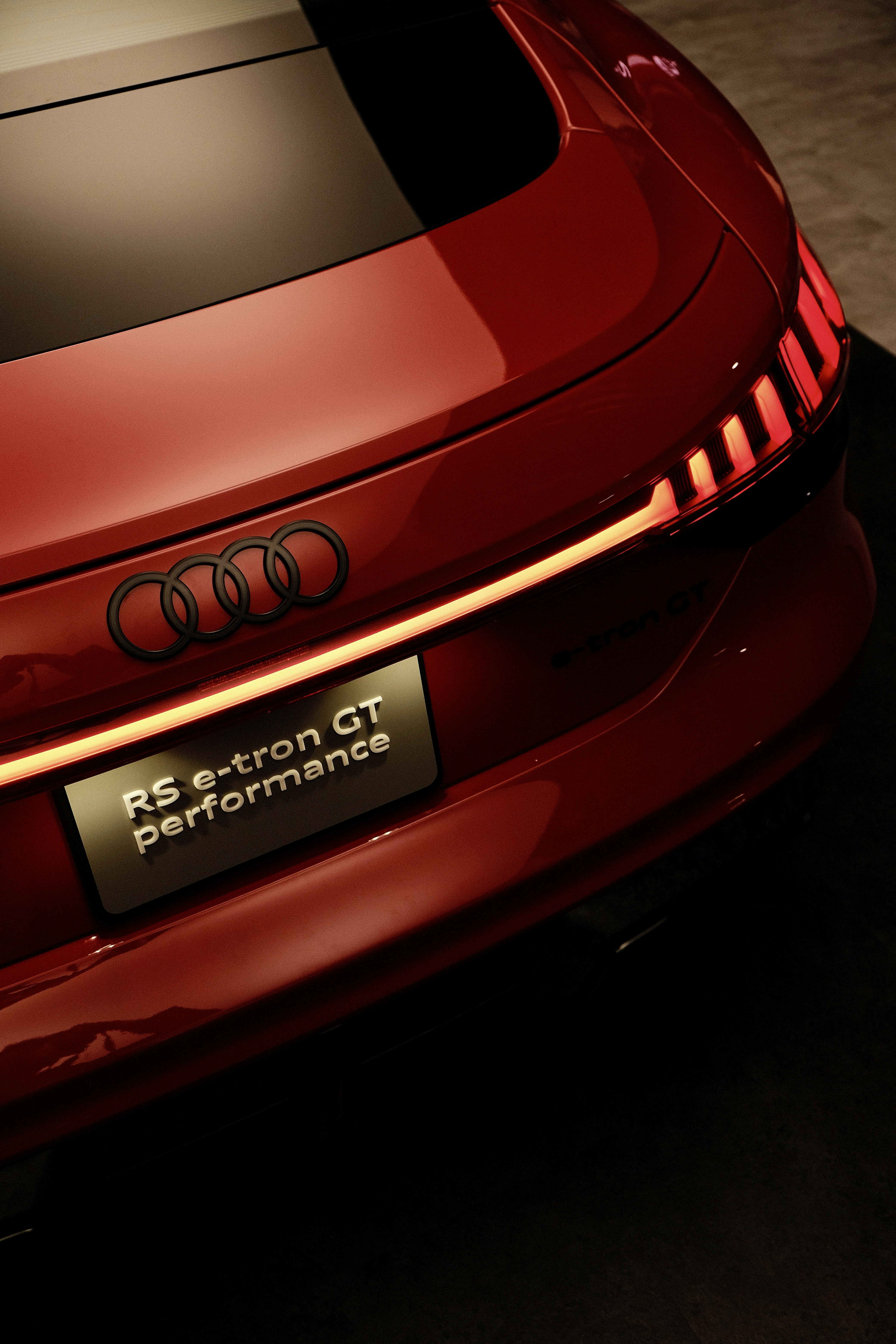 A close up of the rear end of a red car