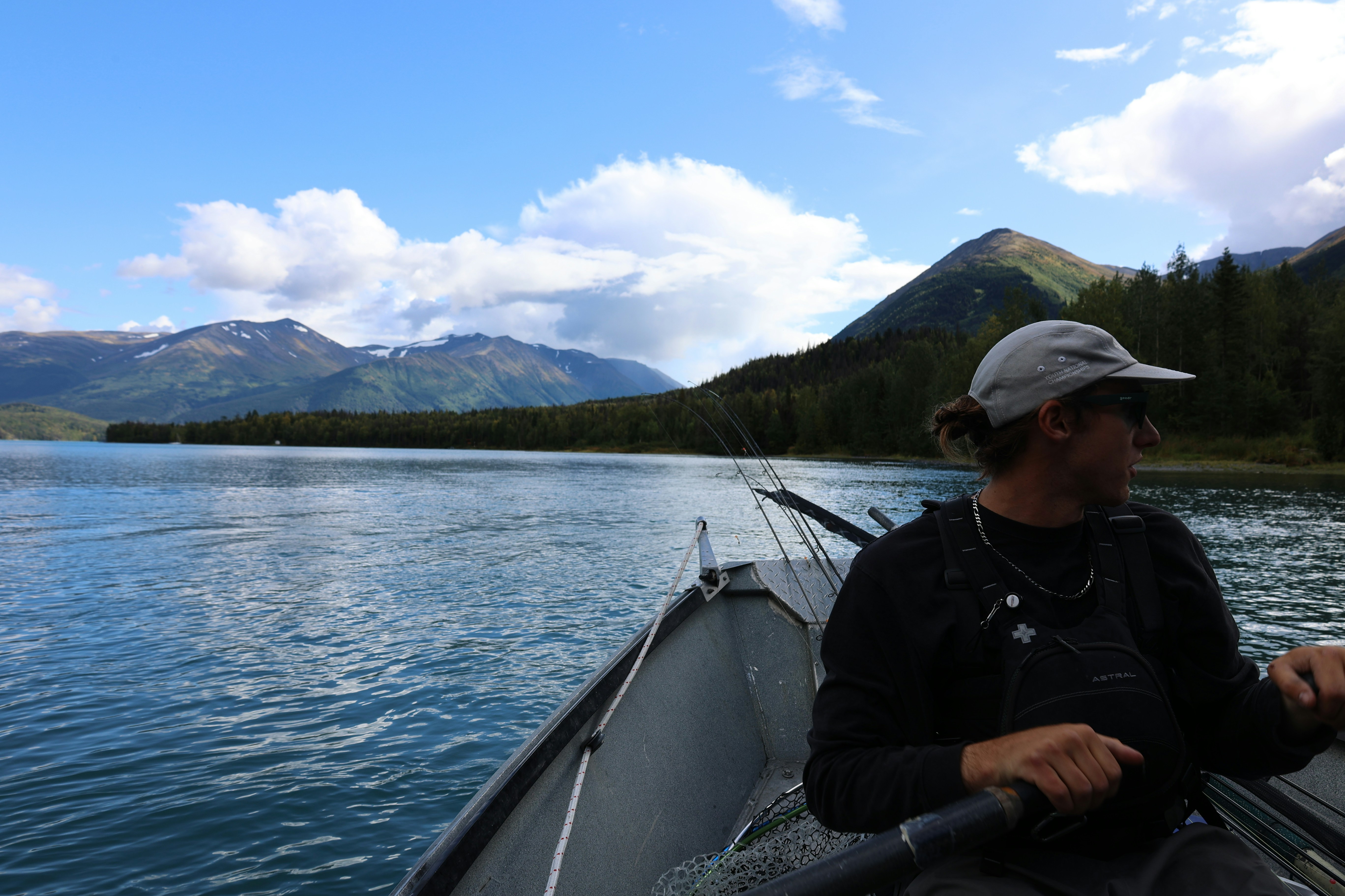 A man sitting in a boat on a lake photo – Free Kenai river Image on ...