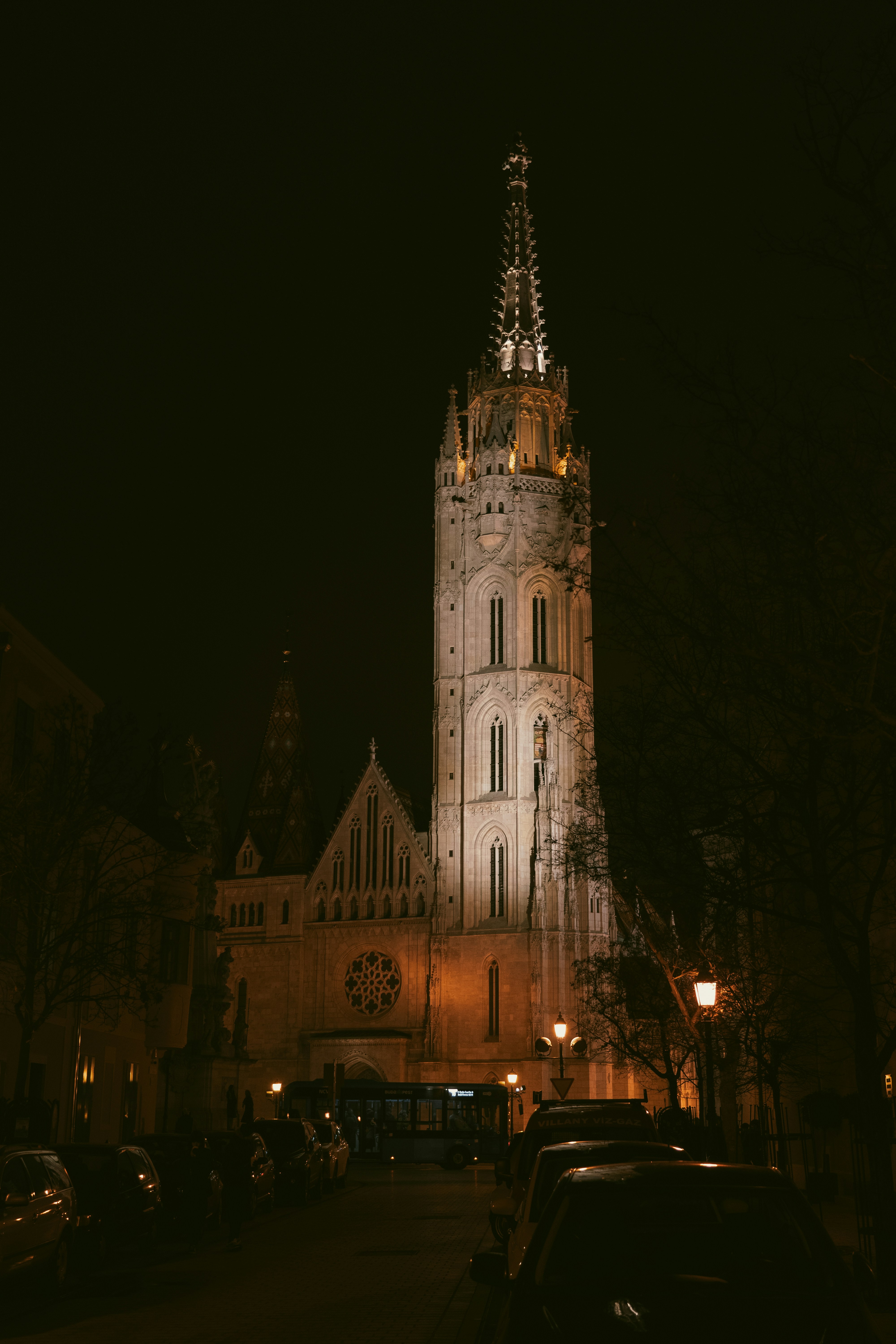 A very tall tower with a clock on it's side