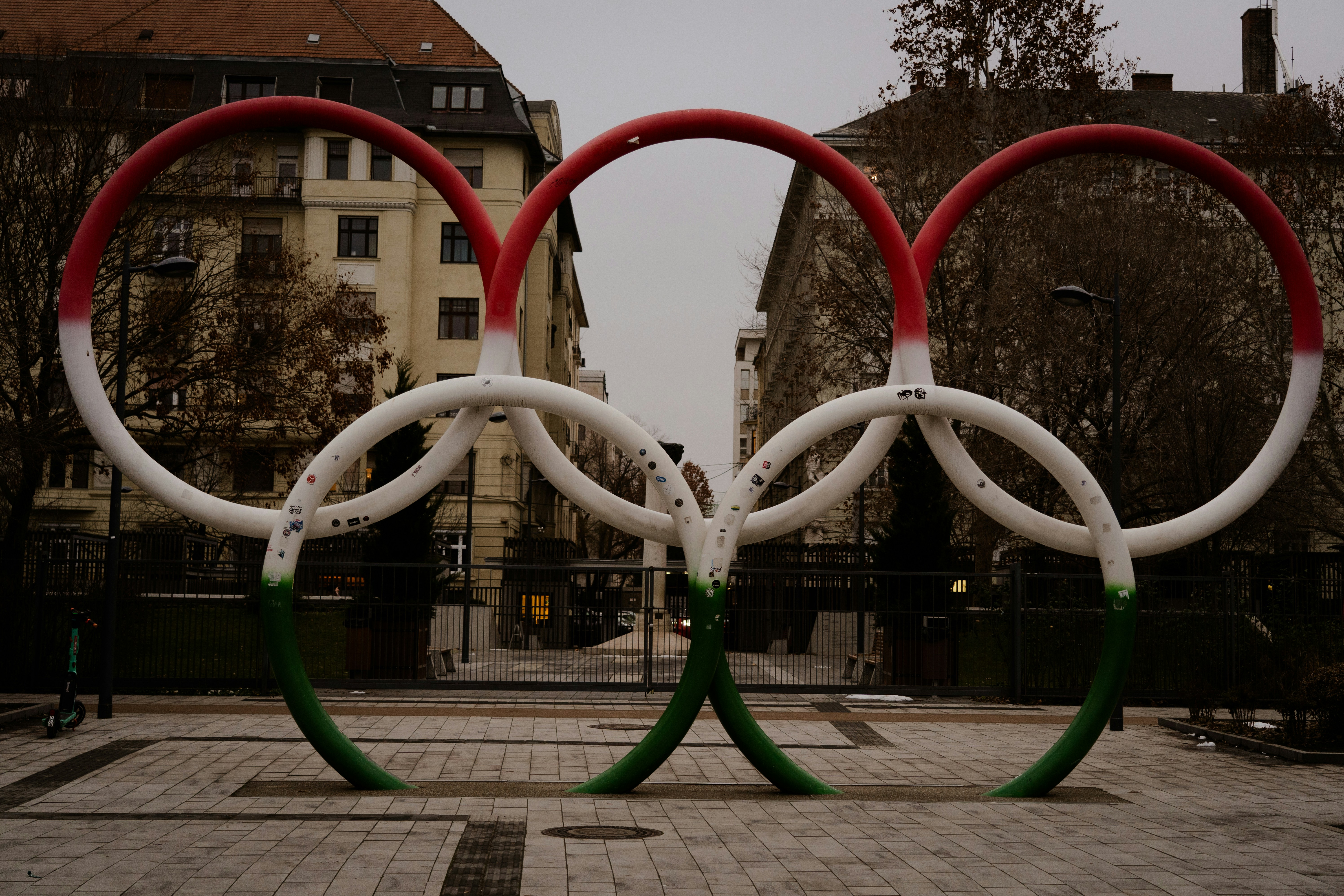 A couple of red and white rings sitting on top of a sidewalk