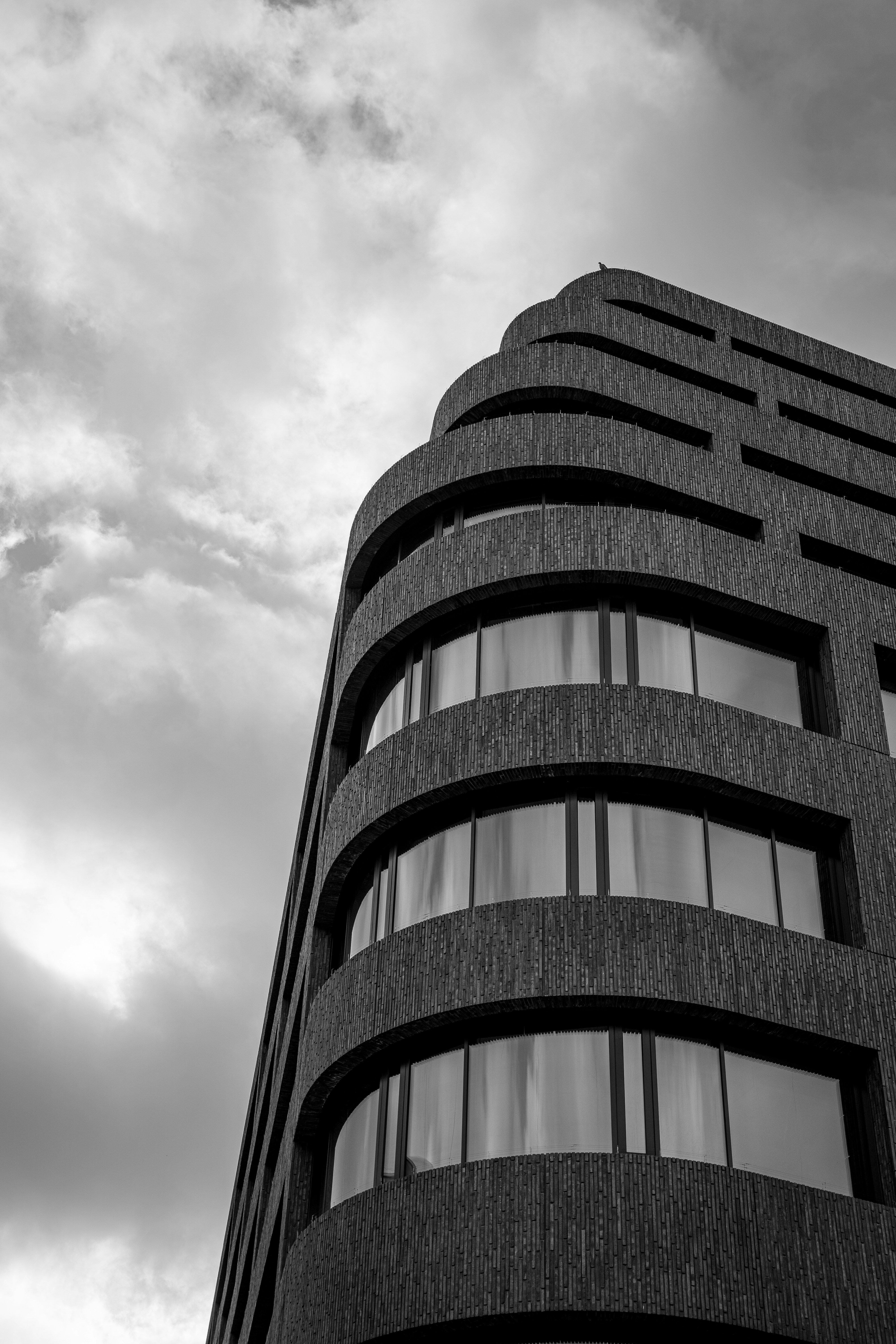 A black and white photo of a tall building