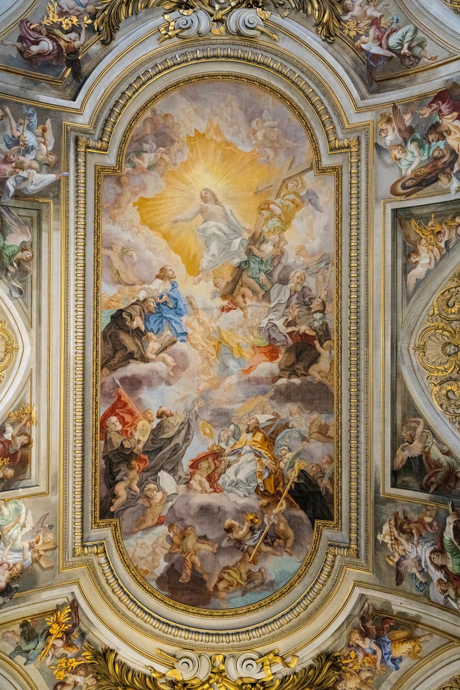 The ceiling of a building with a painting on it