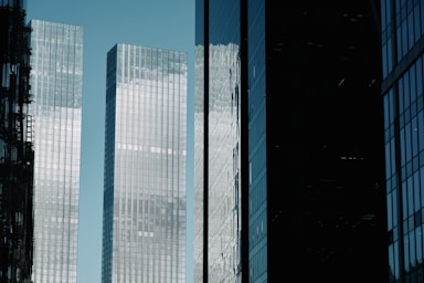 A couple of tall buildings sitting next to each other