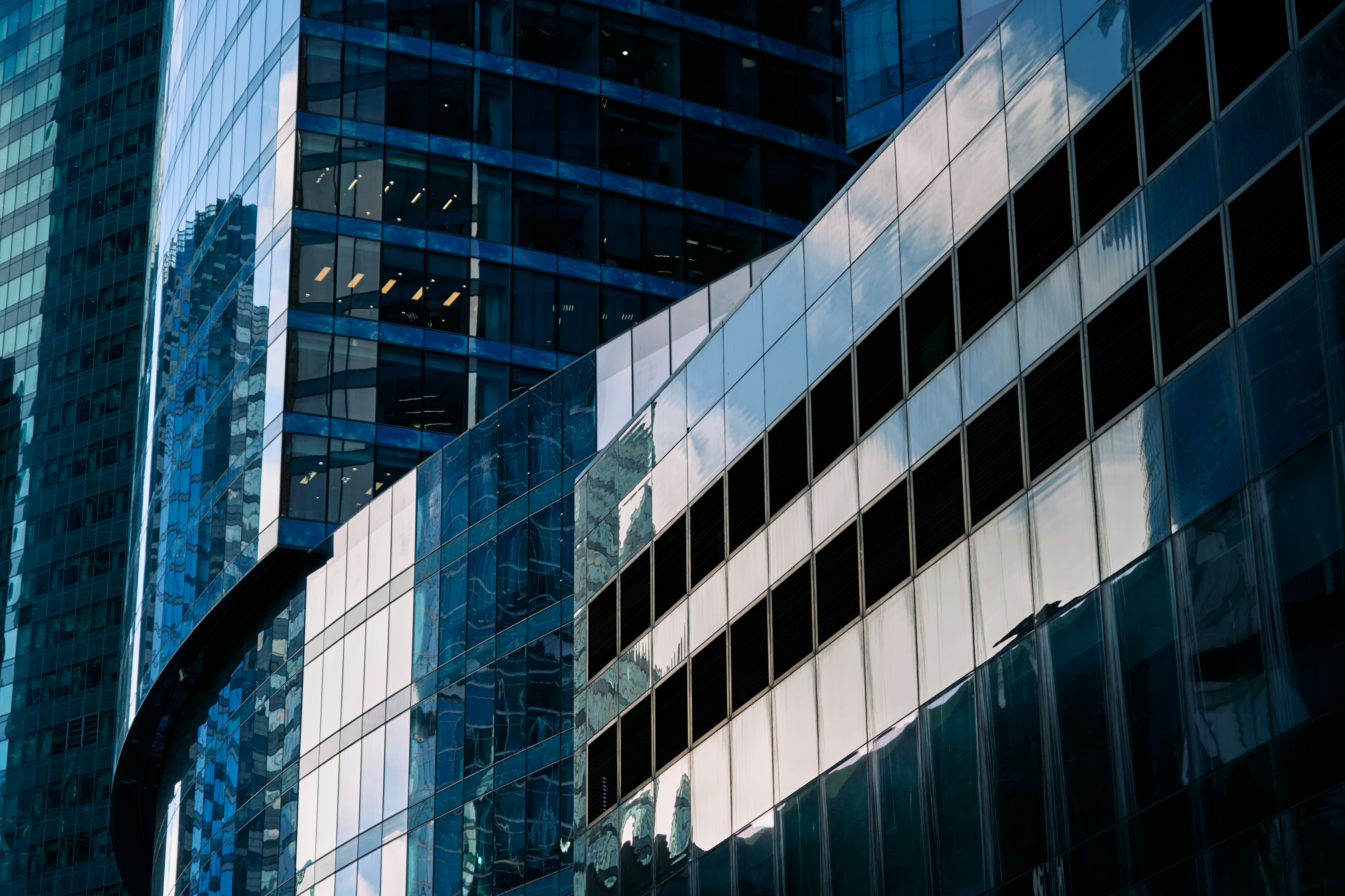 A city street with tall buildings and a traffic light