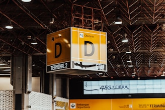 A building with a lot of signs hanging from the ceiling