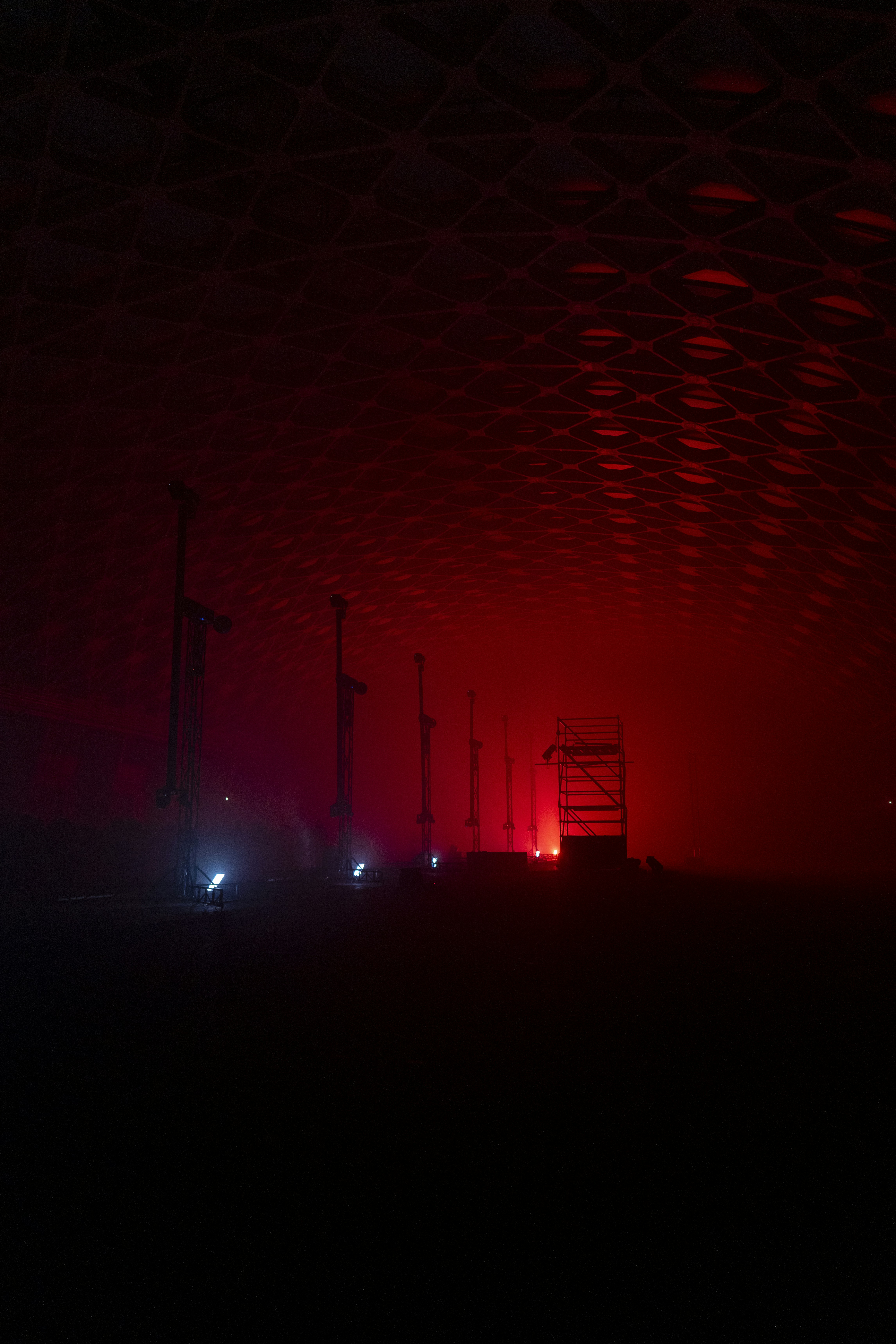 A red light shines in the dark sky