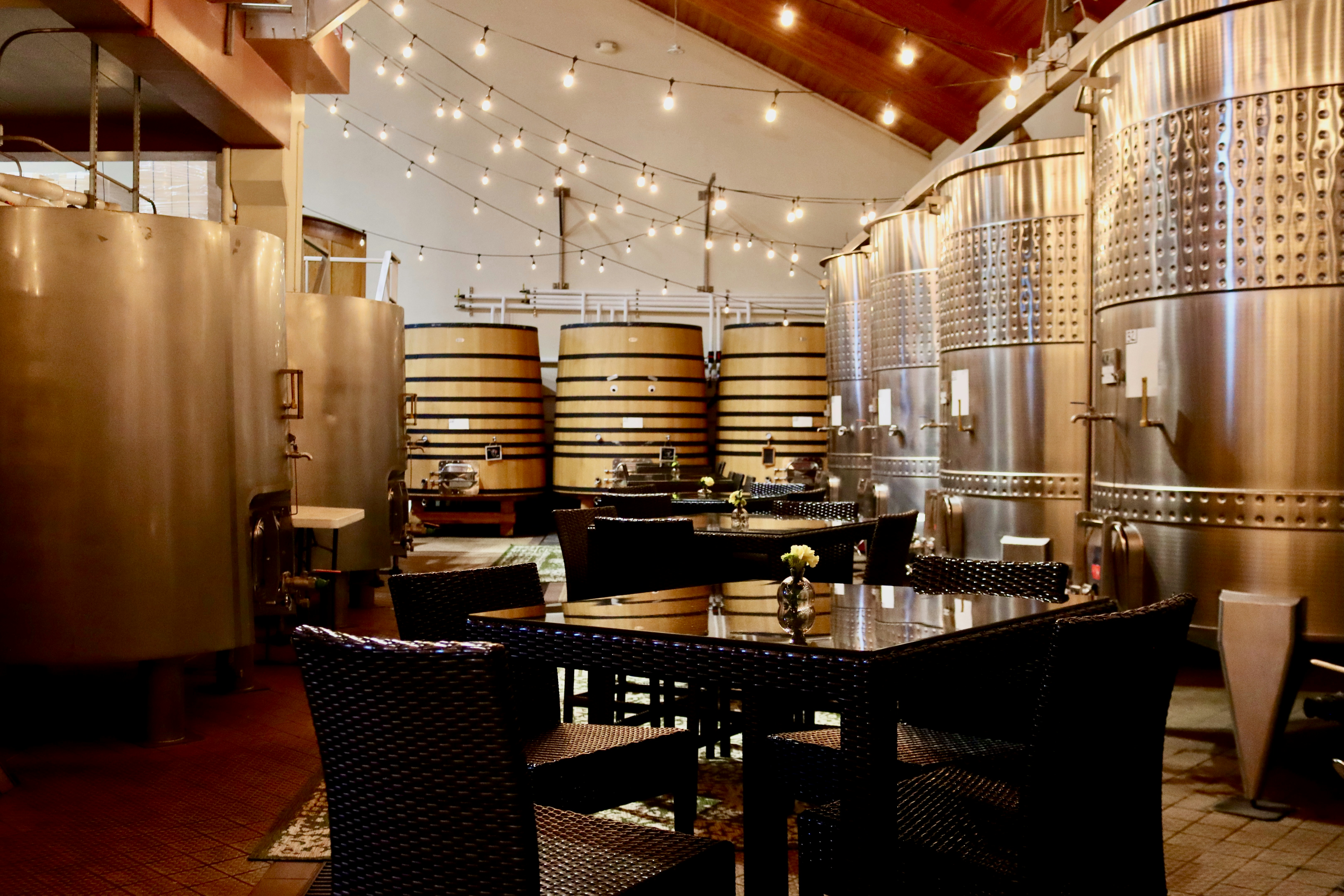 A room filled with lots of wooden barrels