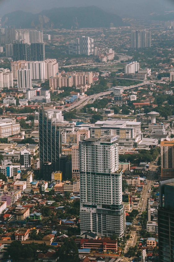 An aerial view of a city with tall buildings