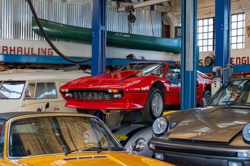 A bunch of cars that are in a garage